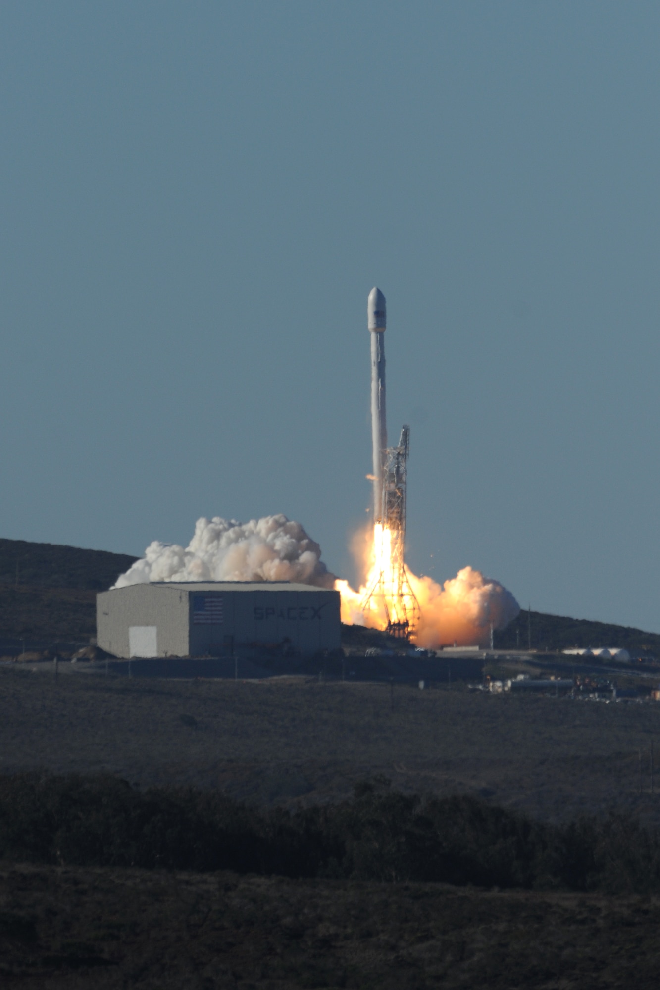 VANDENBERG AIR FORCE BASE, Calif. -- Team Vandenberg launches its first-ever SpaceX launch from Space Launch Complex-4 here Sunday, Sept. 29, 2013. 30th Space Wing's 1st Air and Space Test Squadron was the lead for all launch site certification activities at Vandenberg for SpaceX as an Evolved Expendable Launch Vehicle New Entrant. Under the authority of the Space and Missile Systems Center, the Squadron evaluated SpaceX's flight and ground systems, processes and procedures for this inaugural space launch campaign for the upgraded Falcon-9 rocket.  (U.S. Air Force photo/Michael Peterson)
