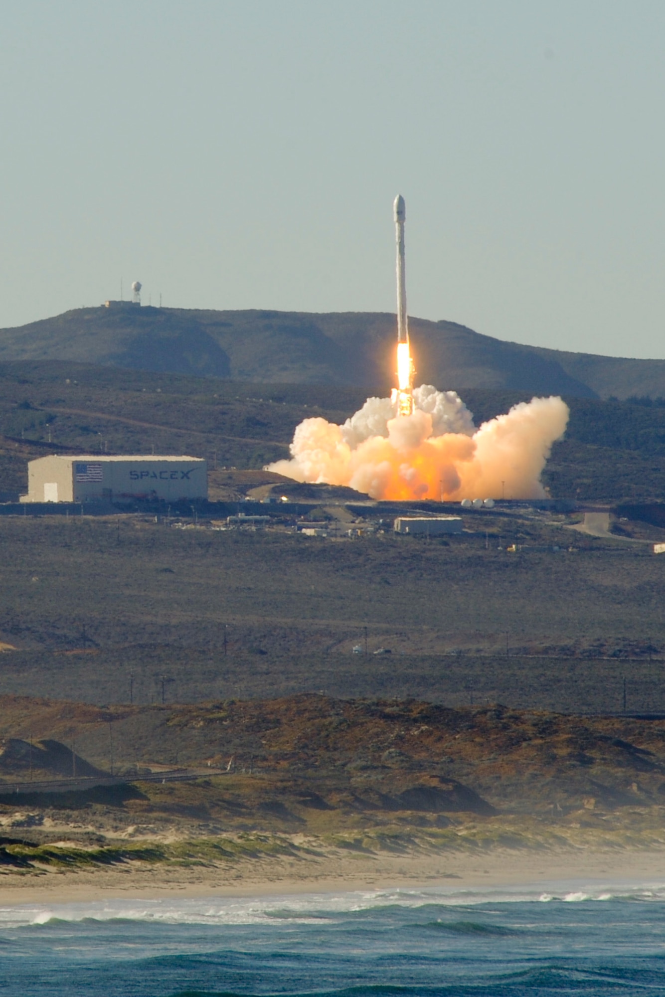 VANDENBERG AIR FORCE BASE, Calif. – Team Vandenberg launches its first-ever SpaceX launch from Space Launch Complex-4 here Sunday, Sept. 29, 2013. 30th Space Wing's 1st Air and Space Test Squadron was the lead for all launch site certification activities at Vandenberg for SpaceX as an Evolved Expendable Launch Vehicle New Entrant. Under the authority of the Space and Missile Systems Center, the Squadron evaluated SpaceX's flight and ground systems, processes and procedures for this inaugural space launch campaign for the upgraded Falcon-9 rocket.