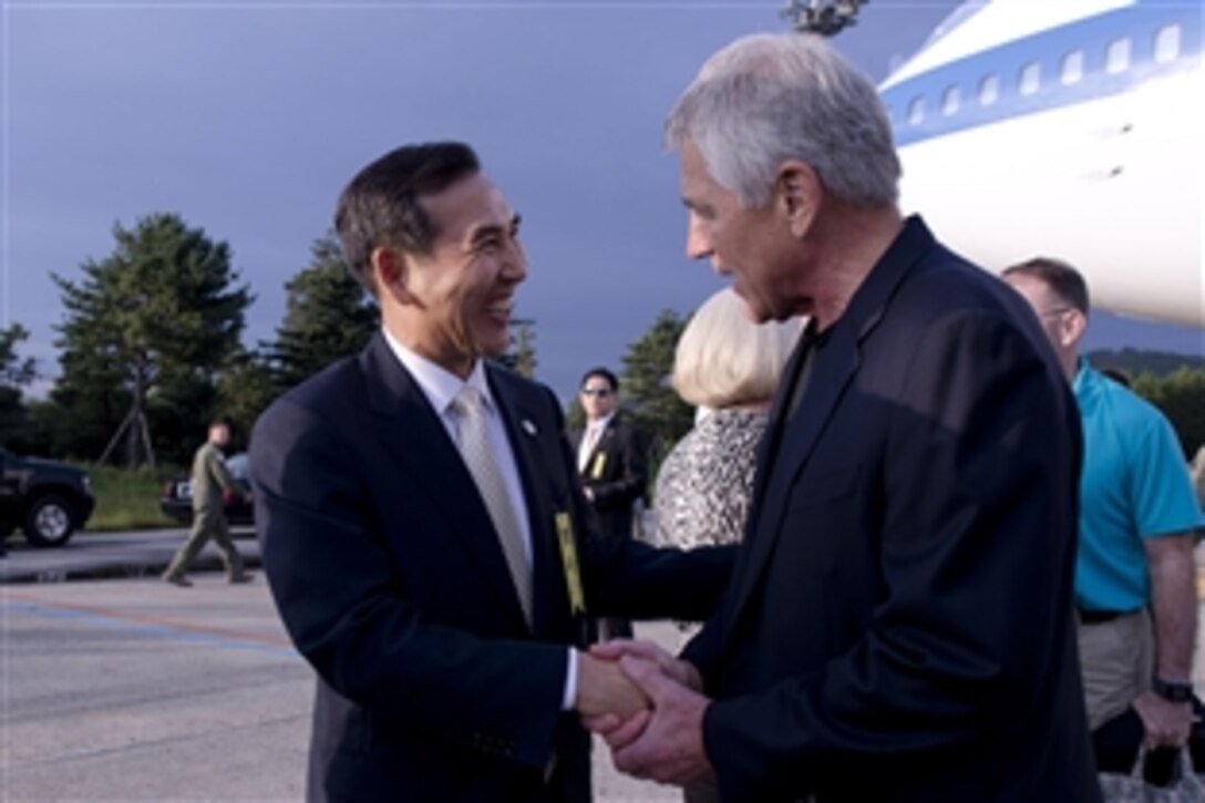 U.S. Defense Secretary Chuck Hagel greets South Korea's Deputy Defense Minister Lim Kwan-bin upon arrival in Seoul, South Korea, Sept. 29, 2013. Hagel plans to celebrate the 60th anniversary of the U.S.-South Korea alliance; participate in the 45th Security Consultative Meeting; preside over the U.S. Forces Korea change of command ceremony and visit U.S. and South Korean troops.