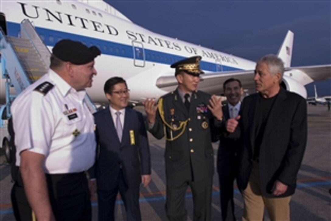 U.S. Defense Secretary Chuck Hagel talks with, from left, U.S. Army Gen. James D. Thurman, commander of Combined Forces Command and U.S. Forces Korea, U.S. Ambassador to South Korea Sung Kim, South Korean Defense Attaché Maj. Gen. Lee Seo Young, and Korea’s Deputy Defense Minister Lim Kwan-bin upon arrival in Seoul, South Korea, Sept. 29, 2013.