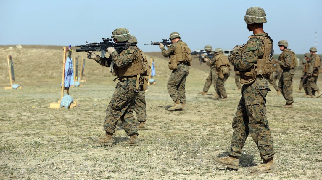 Marines with Black Sea Rotational Force 14 move forward on a target as part of platoon live-fire training at a range near Mihail Kogalniceanu, Romania, Sept. 26, 2013. Conducting effective training as a platoon prepares Marines with BSRF for live-fire training with the Romanian Army and will directly tie in with BSRF 14's mission of promoting regional stability and security, increasing military capacity and interoperability, and maintaining partnerships with their counterparts in Eastern Europe.