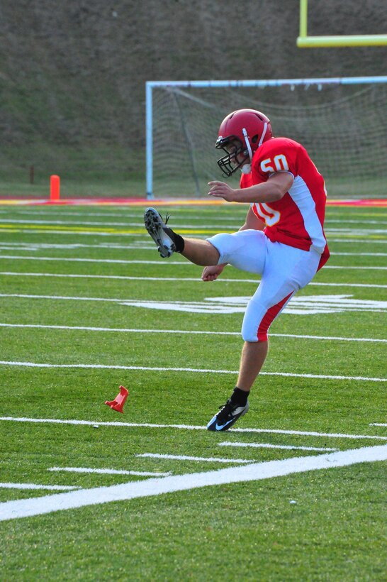 A punter with the Quantico Warriors varsity football team prepares for a game against the Randolph-Macon Academy Yellowjackets from Front Royal, Va., at Butler Stadium on Sept. 23, 2013. The Warriors lost 40-7.  (Marine Corps photo by Lance Cpl. Samuel Ellis/Released)