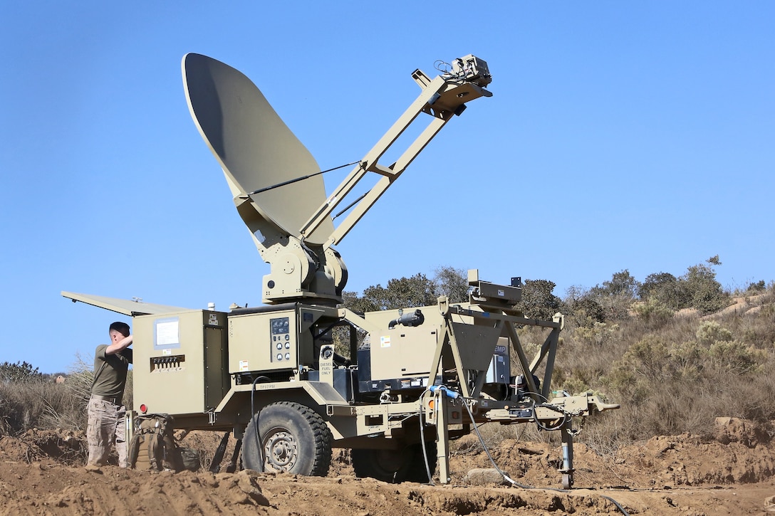 Sergeant Christopher Phillips, a satellite communications operator with Communications Company, Combat Logistics Regiment 17, 1st Marine Logistics Group, operates a satellite terminal during a CLR-17 combat operations exercise aboard Camp Pendleton, Calif., Sept. 16, 2013. Approximately 100 Marines with Communications Co. worked on setting up data, radio and wire communications systems at three sites to enable CLR-17's logistical elements to function and support other forward units with the 1st MLG. 