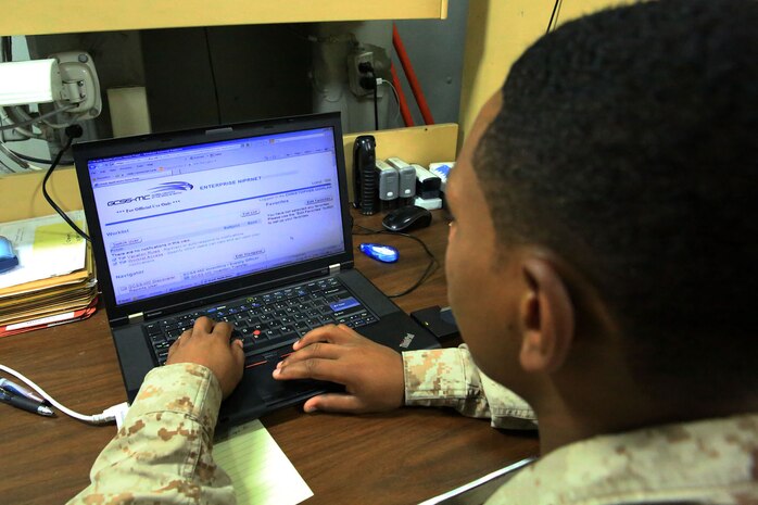 Sgt. Christopher Quinlan, supply administration chief with 13th Marine Expeditionary Unit, analyses task and transaction records kept using the Global Combat Support System-Marine Corps aboard the USS Boxer, Sept. 25. GCSS-MC replaces legacy systems that have been used by Marines more than 40 years. It combines supply and maintenance functions so Marines can transact on a single system.