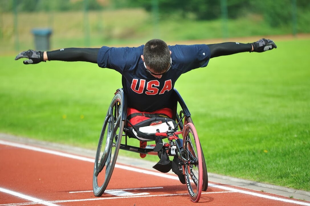 Marine Cpl Ivan Sears prepares for the 100m Wheelchair race of the 2013 CISM Open Integrated/Para Track and Field Championship in Warendorf, Germany 9-16 September.  Sears captured four golds overall in the 100m, 200m, 1500m, and seated shotput.  