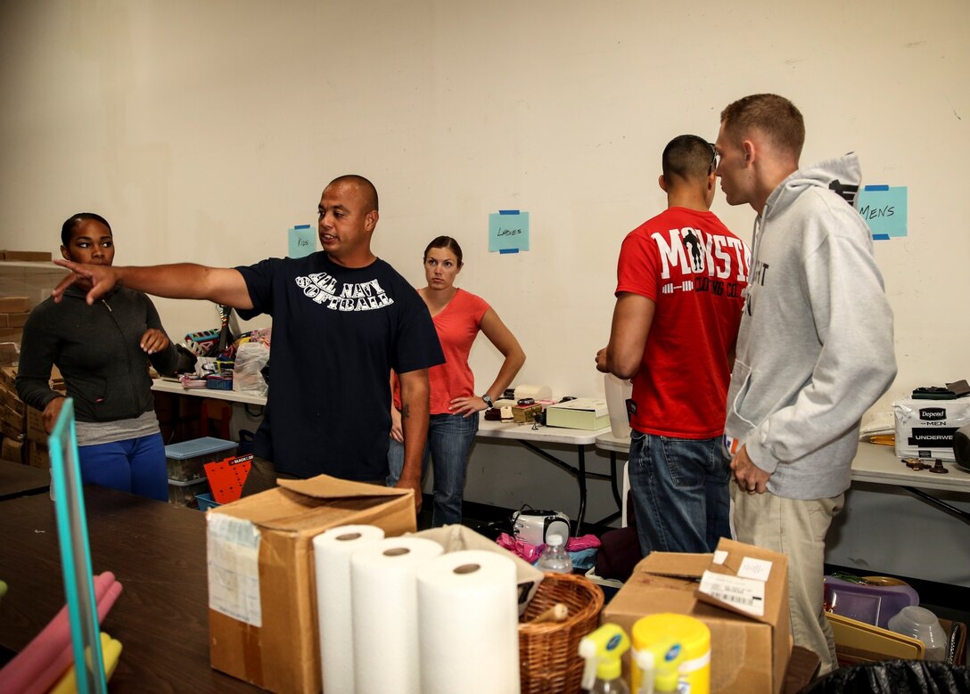 Marines and sailors with the 15th Marine Expeditionary Unit sort through donated items during a volunteer event at The Angel's Depot in Vista, Calif., Sept. 26. All donations go to improving the quality of life for senior citizens. (U.S. Marine Corps photo by Cpl. Emmanuel Ramos/Released)