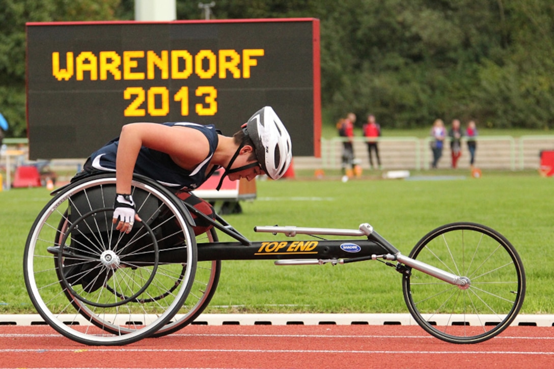 Army SPC Elizabeth Wasil competes against the men, placing first in the women and third overall in the Wheelchair 100m of the 2013 CISM Open Integrated/Para Track and Field Championship in Warendorf, Germany 9-16 Sept