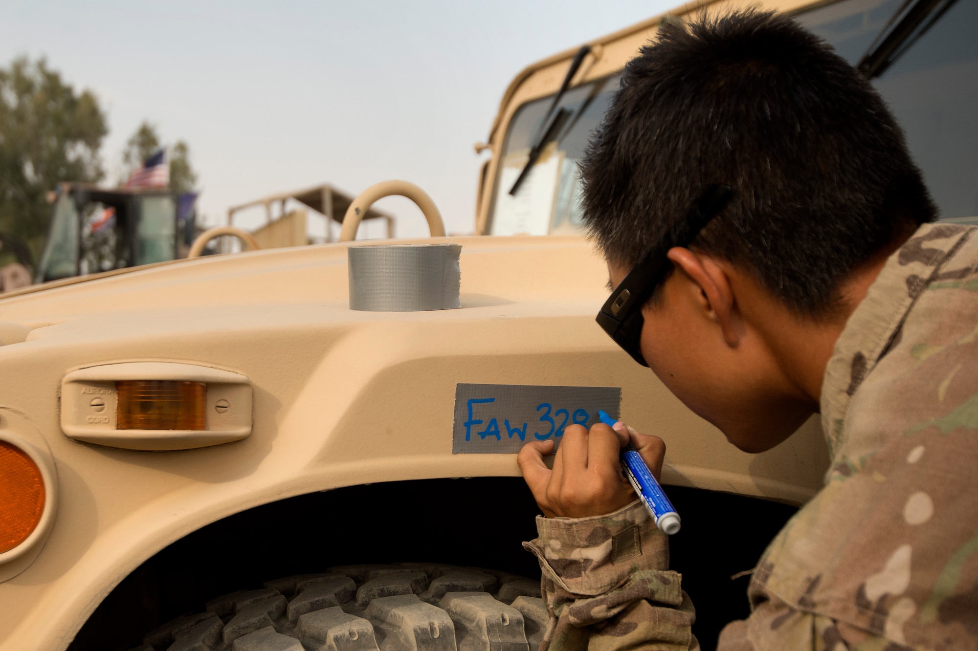 Senior Airman Leah Johnson, 19th Movement Control Team aerial porter, prepares a vehicle for shipping at Forward Operating Base Salerno, Khost province, Afghanistan, Sept. 22, 2013. The 19th MCT, a small squadron of Air Force surface movement controllers and aerial porters, have the herculean task of overseeing the vast majority of retrograde operations at FOB Salerno. 