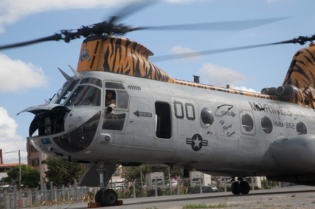 The last of the CH-46Es in Okinawa lands Sept. 30 on Camp Kinser for storage and disposition. The CH-46E Sea Knight, affectionately called “the Phrog,” has served with the Marine Corps and Marine Medium Tiltrotor Squadron 262 since the Vietnam War. The VMM-262 “Flying Tigers” have used the CH-46 to participate in engagements such as Operation Iraqi Freedom in Iraq, Operation Unified Assistance in Southeast Asia, and, most recently, Operation Tomodachi in response to the Great East Japan Earthquake and subsequent tsunami. After serving faithfully for decades, the Phrog’s service has ended, paving the way for the MV-22B Osprey to take over. Aircraft “00” has a paint scheme unique to the “Flying Tigers” of Marine Medium Tiltrotor Squadron 262.