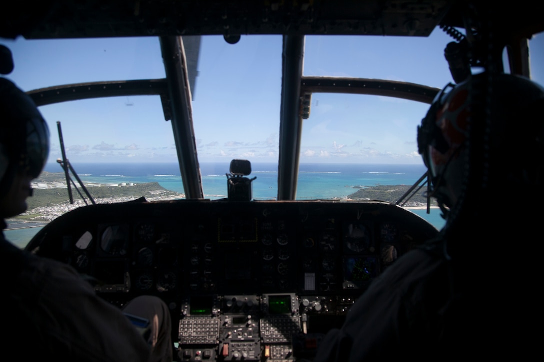Capt. Luke Williamson, left, navigates the CH-46 during its last flight Sept. 30 from Marine Corps Air Station Futenma to its place of rest on Camp Kinser. The CH-46E Sea Knight, affectionately called “the Phrog,” has served with the Marine Corps and Marine Medium Tiltrotor Squadron 262 since the Vietnam War. The VMM-262 “Flying Tigers” have used the CH-46 to participate in engagements such as Operation Iraqi Freedom in Iraq, Operation Unified Assistance in Southeast Asia, and, most recently, Operation Tomodachi in response to the Great East Japan Earthquake and subsequent tsunami. After serving faithfully for decades, the Phrog’s service has ended, paving the way for the MV-22B Osprey to take over. Williamson is a CH-46E pilot with VMM-262, Marine Aircraft Group 36, 1st Marine Air Wing, III Marine Expeditionary Force. (U.S. Marine Corps photo by Lance Cpl. Natalie M. Rostran/ Released)