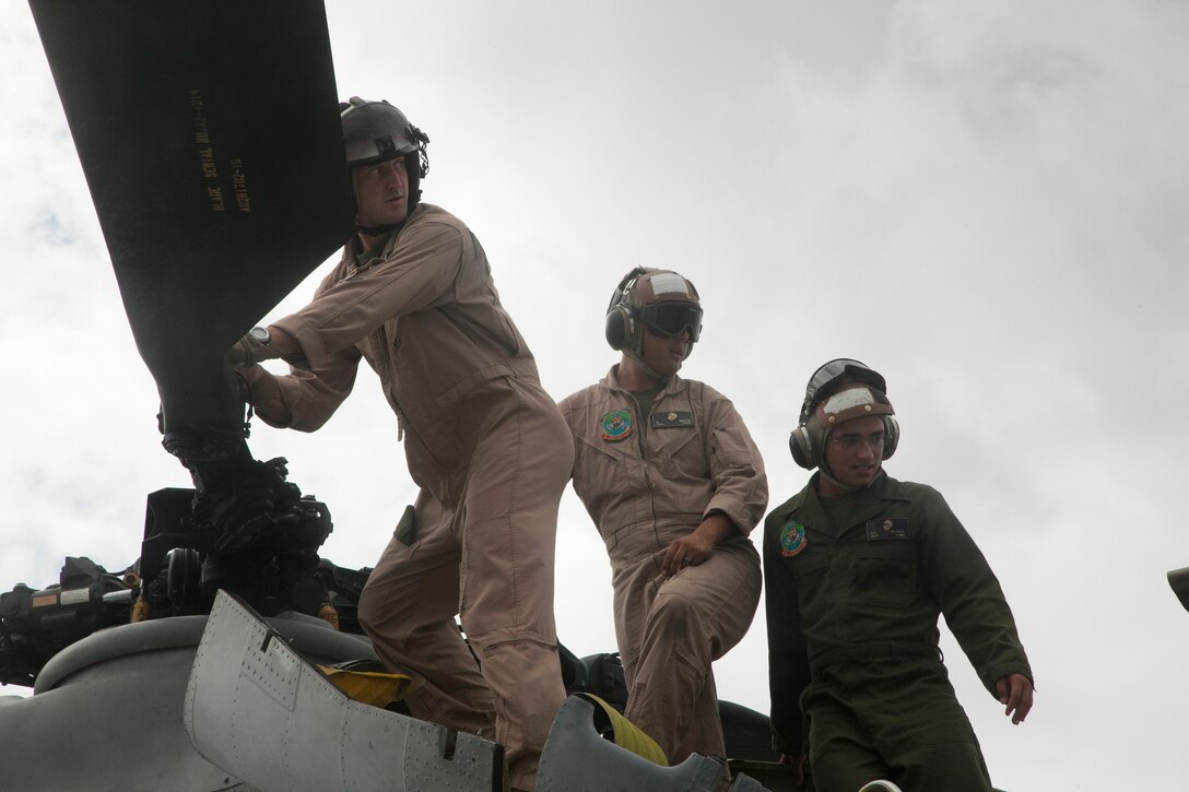 Marines with VMM-262 prepare a CH-46E for storage and disposition Sept. 30 on Camp Kinser after its last flight over Okinawa. The CH-46E Sea Knight, affectionately called “the Phrog,” has served with the Marine Corps and Marine Medium Tiltrotor Squadron 262 since the Vietnam War. The VMM-262 “Flying Tigers” have used the CH-46 to participate in engagements such as Operation Iraqi Freedom in Iraq, Operation Unified Assistance in Southeast Asia, and, most recently, Operation Tomodachi in response to the Great East Japan Earthquake and subsequent tsunami. After serving faithfully for decades, the Phrog’s service has ended, paving the way for the MV-22B Osprey to take over. The Marines are with VMM-262, Marine Aircraft Group 36, 1st Marine Air Wing, III Marine Expeditionary Force.