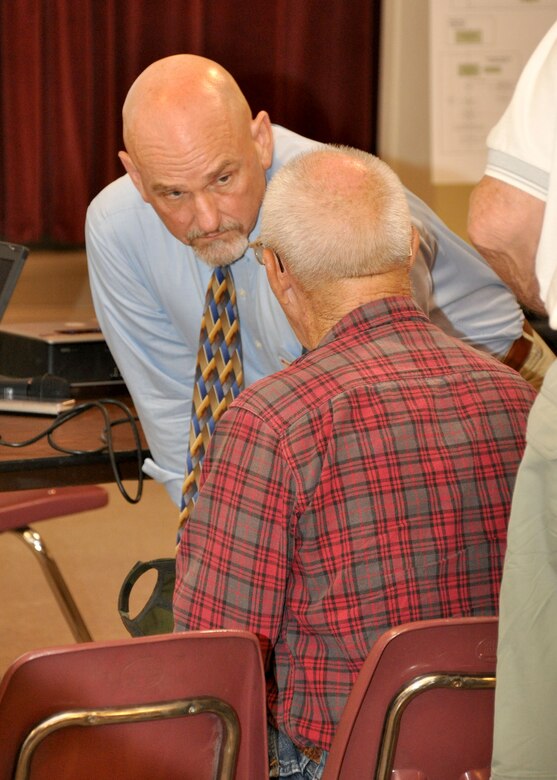 KEARNEY, ARIZ. – Mike Langley, A senior project manager in the U.S. Army Corps of Engineers Los Angeles District Arizona-Nevada Area Office’s Regulatory Division, talks with a member of the local community during a public meeting held Sept. 24 for the proposed new tailings facility for Asarco’s Ray Mine. Langley is working on drafting an Environmental Impact Statement for the proposed facility and held the meeting to set forth the plan the District is working on during the course of the study. 