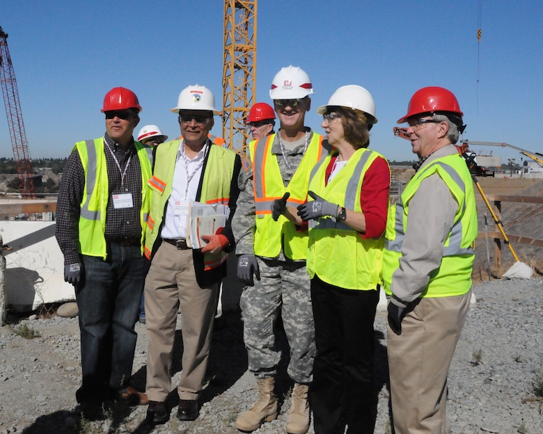 Central Valley Flood Protection Board members tour the Folsom Dam auxiliary spillway in Folsom, Calif., with U.S. Army Corps of Engineers staff  and other federal and state partners Sept. 27, 2013. From left: Michael Villines, CVFPB board member; Jay Punia, CVFPB executive officer; Col. Michael Farrell, Sacramento District commander; Jane Dolan, CVFPB secretary; and William Edgar, CVFPB president. 