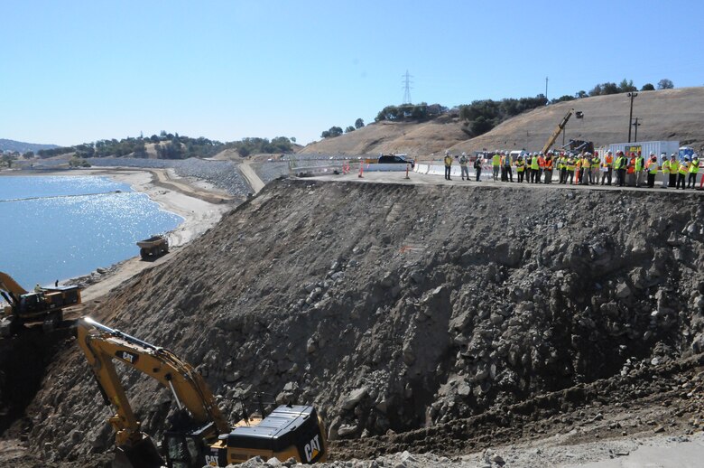 Central Valley Flood Protection Board members and other Folsom Dam auxiliary spillway project partners tour the spillway project construction site Sept. 27, 2013 in Folsom, Calif. Preparation work, shown, is to eventually connect the lake with the spillway. 
