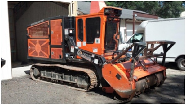 A mulcher used in vegetation clearance on Army ranges. Program contractors modified the mulchers improving their toughness and reliability.