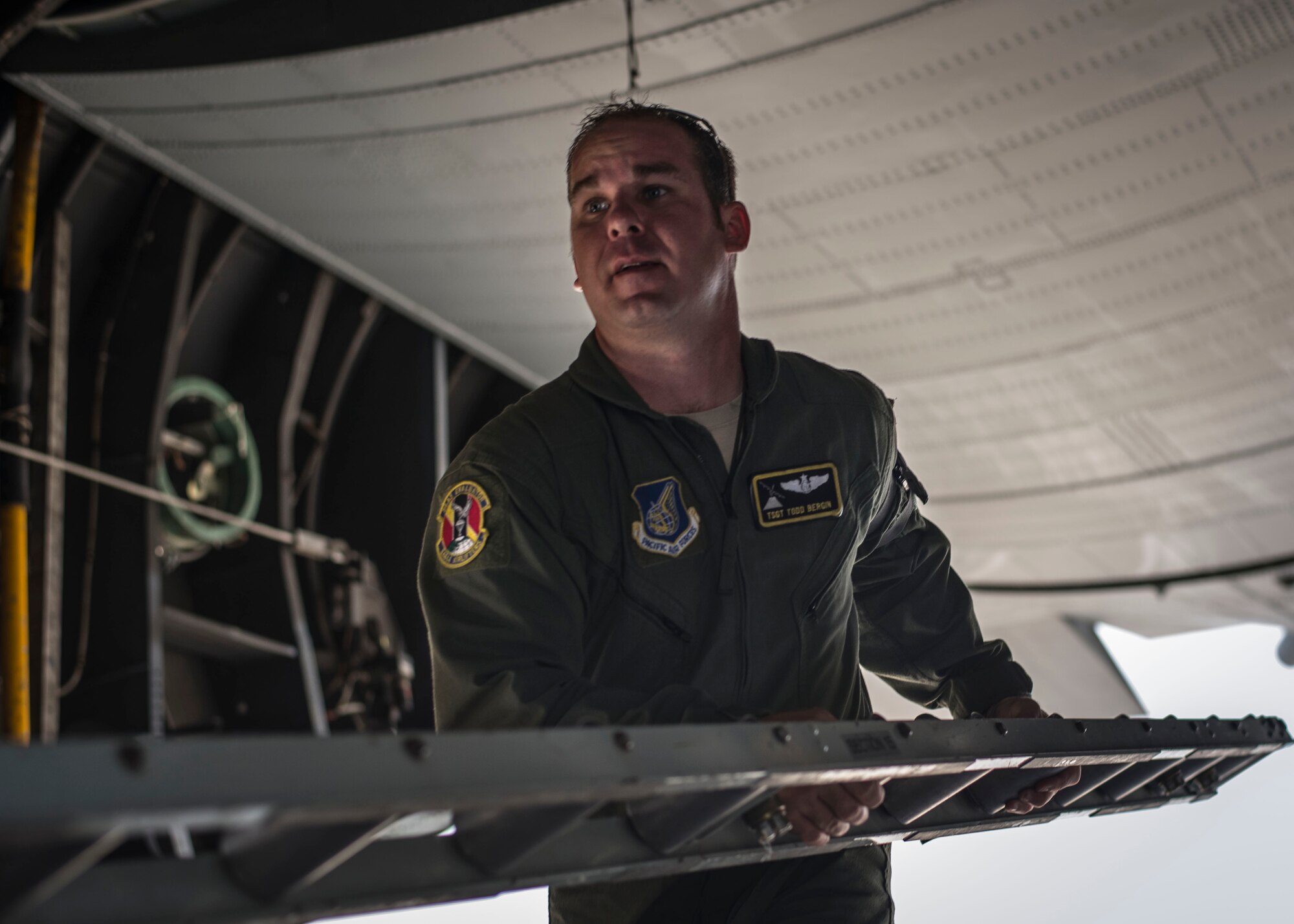Tech. Sgt. Todd Bergin, 36th Airlift Squadron loadmaster, reconfigures a C-130 Hercules cargo compartment before loading a Next Generation Small Loader aboard the aircraft during a training session at Yokota Air Base, Japan, Sept. 30, 2013. The training was designed to give Yokota’s newest airlifters the opportunity to practice loading and off-loading large cargo. (U.S. Air Force photo by Captain Raymond P. Geoffroy/Released)