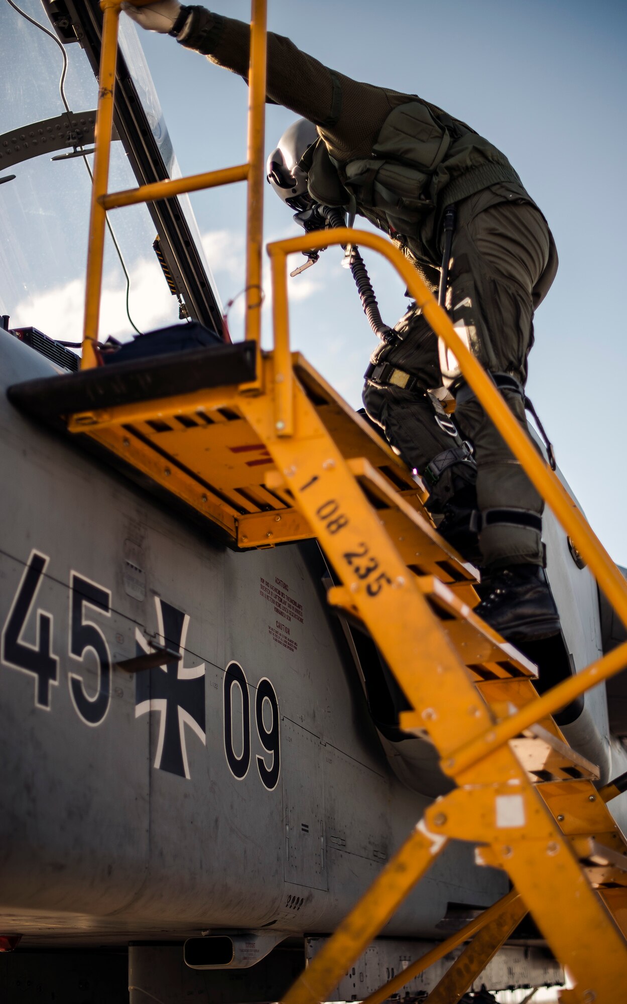A German Air Force pilot disembarks his AG-51 Tornado at Mountain Home Air Force Base, Idaho, Sept. 30, 2013. The Tornados will be at Mountain Home from Sept. 30 through Oct. 19 for Mountain Roundup 2013, an exercise that is part of the German Air Force Tornado Fighter Weapons Instructor Course Mission Employment (ME) Phase. (U.S. Air Force photo by Master Sgt. Kevin Wallace/RELEASED)
