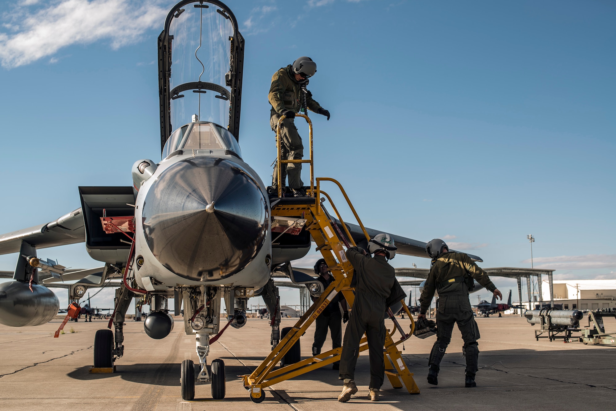A German Air Force crew chief accomplishes post-flight checks as pilots disembark their AG-51 Tornado at Mountain Home Air Force Base, Idaho, Sept. 30, 2013. The Tornados will be at Mountain Home from Sept. 30 through Oct. 19 for Mountain Roundup 2013, an exercise that is part of the German Air Force Tornado Fighter Weapons Instructor Course Mission Employment (ME) Phase. (U.S. Air Force photo by Master Sgt. Kevin Wallace/RELEASED)