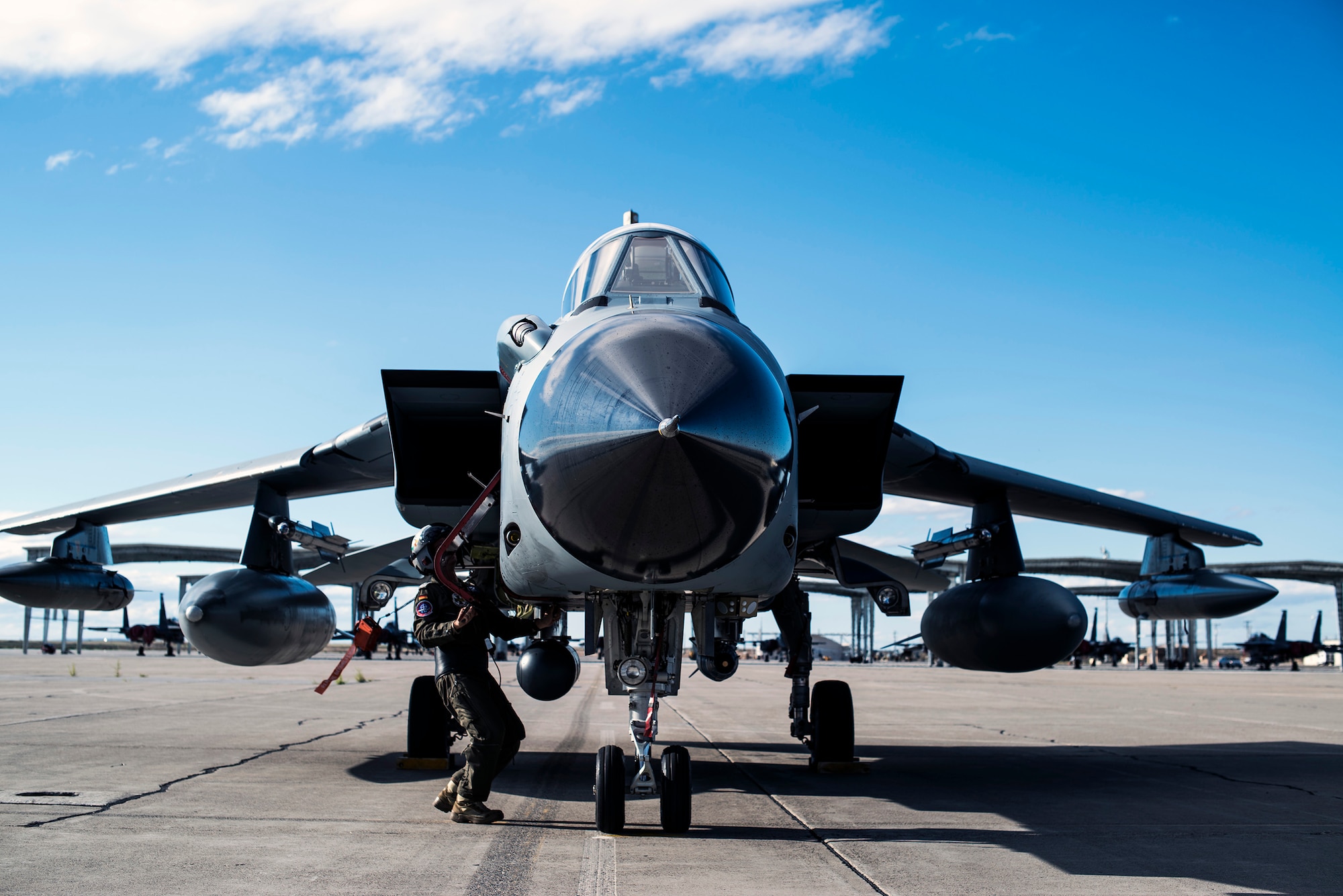 A German Air Force crew chief accomplishes post-flight checks as pilots disembark their AG-51 Tornado at Mountain Home Air Force Base, Idaho, Sept. 30, 2013. The Tornados will be at Mountain Home from Sept. 30 through Oct. 19 for Mountain Roundup 2013, an exercise that is part of the German Air Force Tornado Fighter Weapons Instructor Course Mission Employment (ME) Phase. (U.S. Air Force photo by Master Sgt. Kevin Wallace/RELEASED)