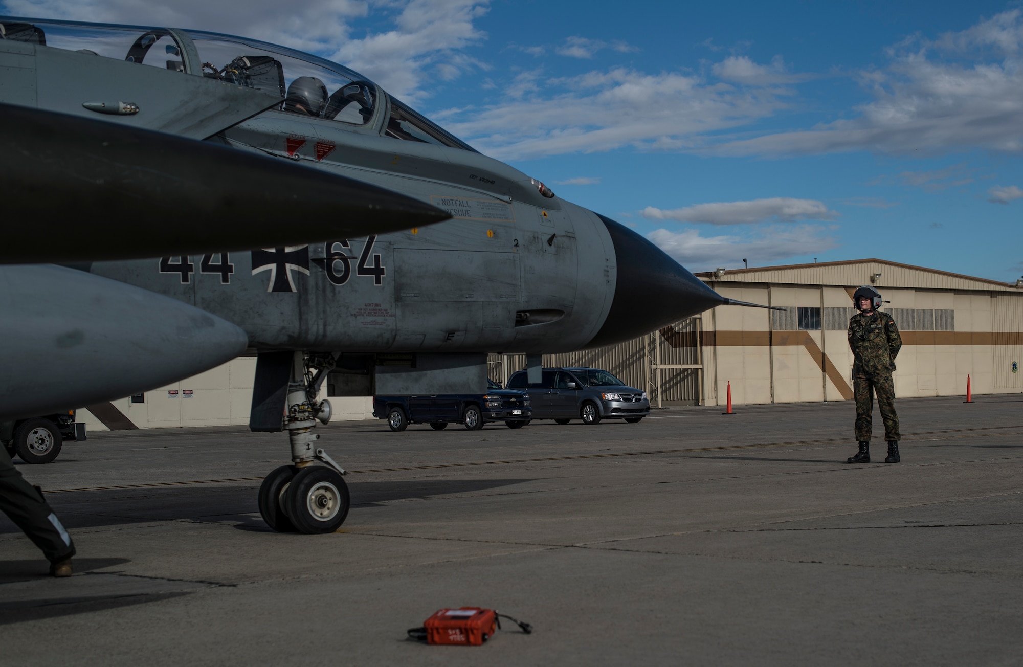 German Air Force Staff Sgt. Christoph Bretz, a GAF crew chief, prepares to chalk and park an AG-51 Tornados land at Mountain Home Air Force Base, Idaho, Sept. 30, 2013. The Tornados will be at Mountain Home from Sept. 30 through Oct. 19 for Mountain Roundup 2013, an exercise that is part of the German Air Force Tornado Fighter Weapons Instructor Course Mission Employment (ME) Phase. (U.S. Air Force photo by Master Sgt. Kevin Wallace/RELEASED)
