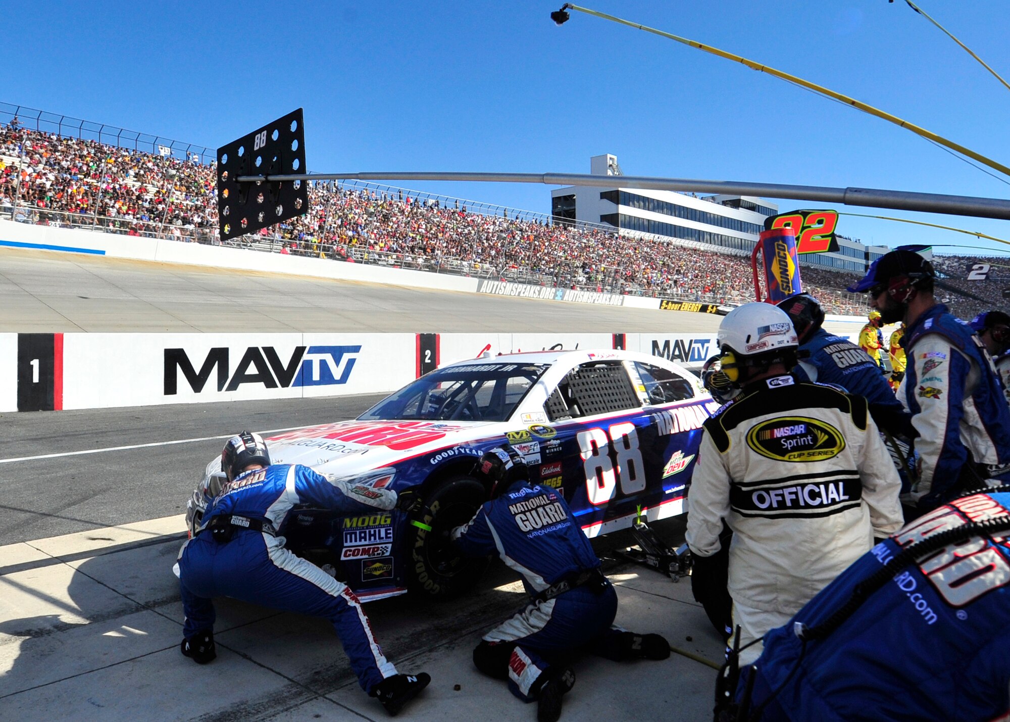 Pit crew members for Dale Earnhardt, Jr., driver of the No. 88 National Guard Chevy, work on his car during a green-flag pit stop during the AAA 400 Sept. 29, 2013, at Dover International Speedway in Dover, Del. Earnhardt, who started the race from the pole position, finished in second place. (U.S. Air Force photo/Tech. Sgt. Chuck Walker)