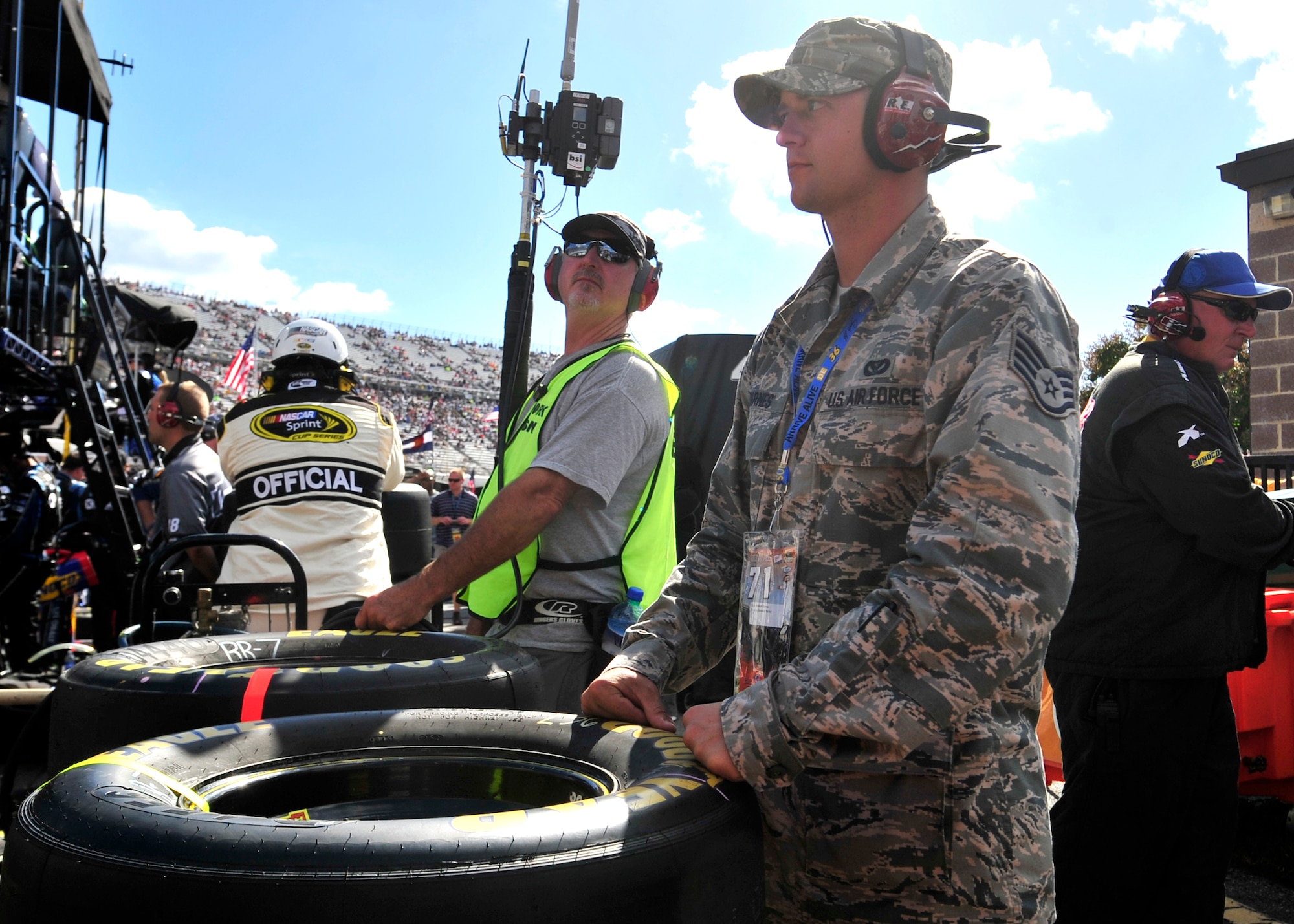 Staff Sgt. Robert Barnes, 436th Civil Engineer Squadron, watches the AAA 400 from the pit of Dave Blaney, driver of the No. 7 Tommy Baldwin Racing Chevy, Sept. 29, 2013, at Dover International Speedway in Dover, Del. Barnes was serving as an honorary pit crew member for Blaney. (U.S. Air Force photo/Tech. Sgt. Chuck Walker)