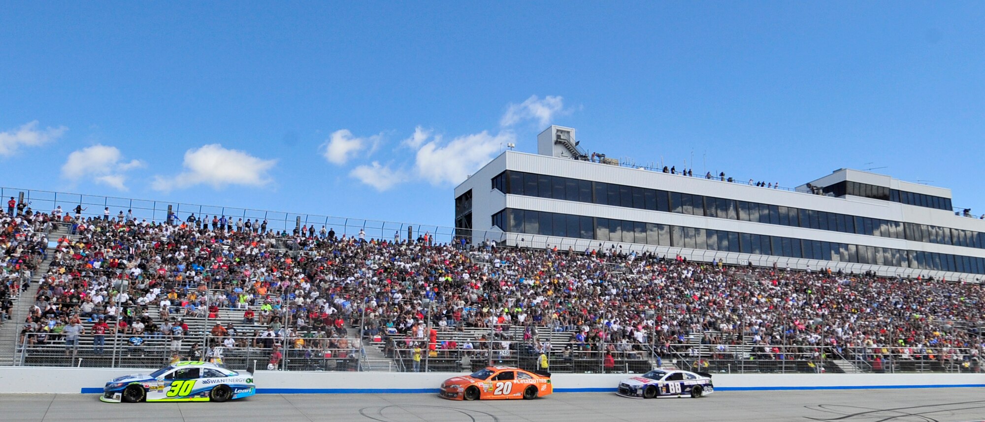 Drivers race down the front stretch into turn one during the AAA 400 Sept. 29, 2013, at Dover International Speedway in Dover, Del. Jimmie Johnson, driver of the No. 48 Kobalt Chevy, won the race for a record-breaking eighth time. (U.S. Air Force photo/Tech. Sgt. Chuck Walker)