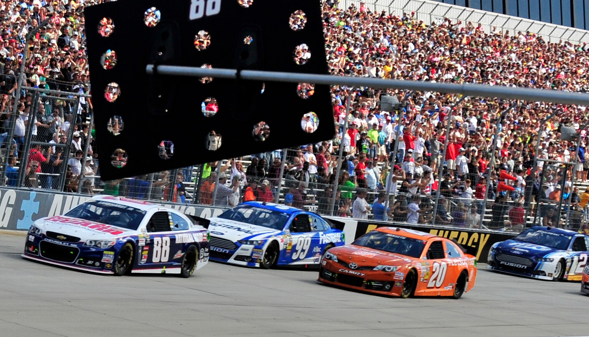 Dale Earnhardt, Jr., driver of the No. 88 National Guard Chevy, leads the drivers down the front stretch at the start of the AAA 400 Sept. 29, 2013, at Dover International Speedway in Dover, Del. Earnhardt started the race from the pole and finished in second place. (U.S. Air Force photo/Tech. Sgt. Chuck Walker)