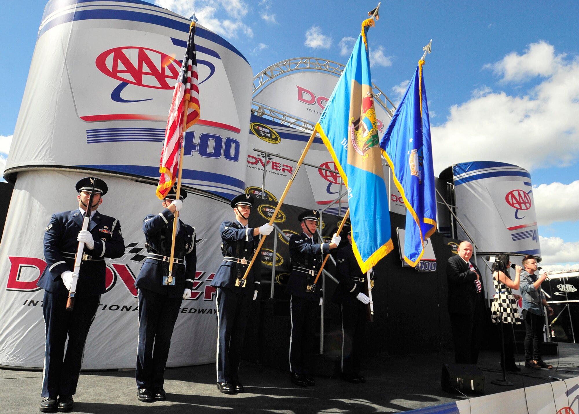 Members of the Team Dover honor guard present the colors during the national anthem before the start of the AAA 400 Sept. 29, 2013, at Dover International Speedway in Dover, Del. Members of Team Dover participated in a variety of activities in support of race weekend. (U.S. Air Force photo/Tech. Sgt. Chuck Walker)