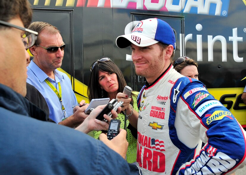 Dale Earnhardt, Jr., driver of the No. 88 National Guard Chevy, walks to the media interview area following his qualifying run for the AAA 400 Sept. 27, 2013, at Dover International Speedway in Dover, Del. Earnhardt earned the pole position, setting a new track record in the process. (U.S. Air Force photo/Tech. Sgt. Chuck Walker)