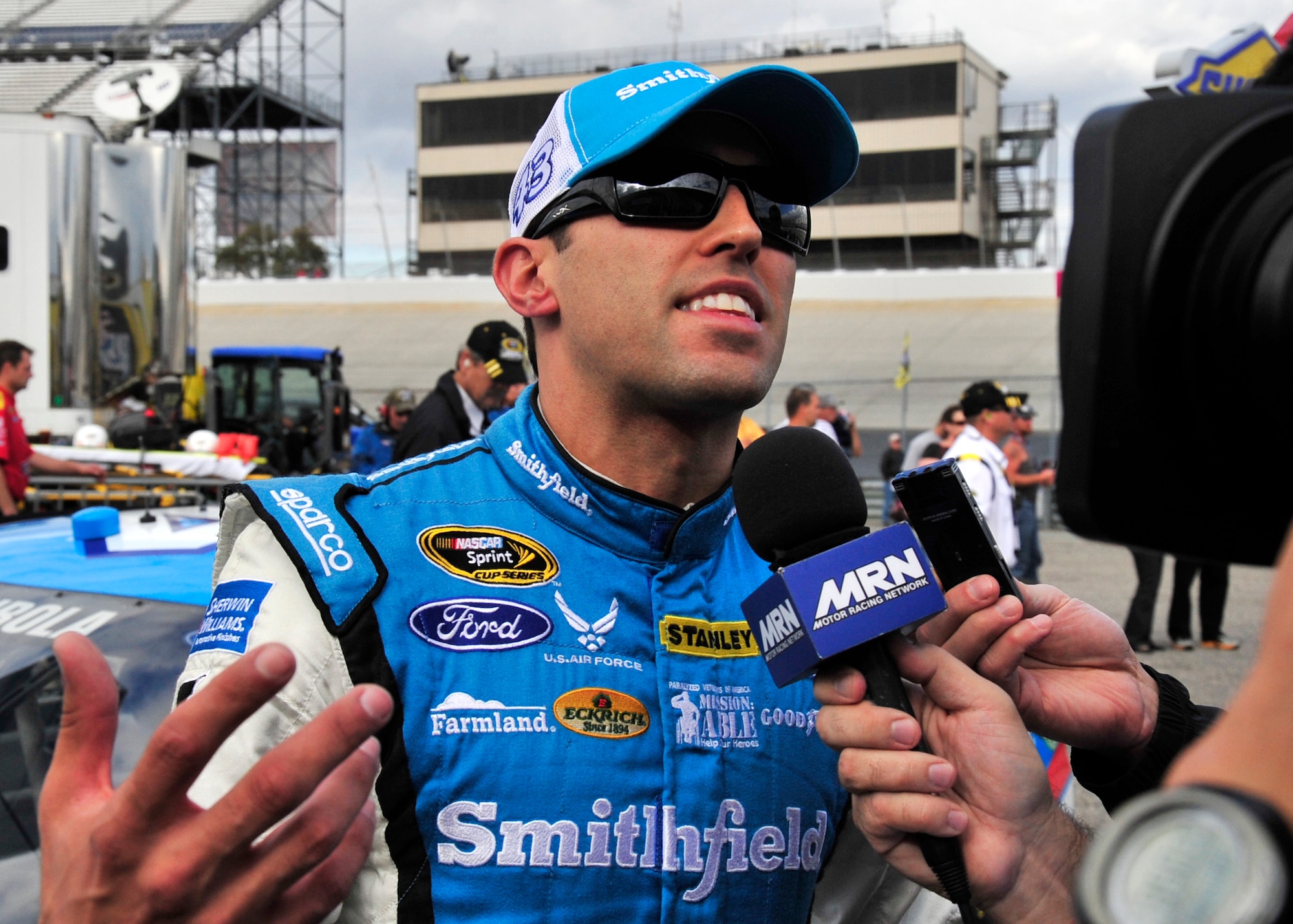 Aric Almirola, driver of the No. 43 Smithfield/U.S. Air Force Ford, speaks with members of the media following his qualifying run for the AAA 400 Sept. 27, 2013, at Dover International Speedway in Dover, Del. Almirola qualified in fifth place. (U.S. Air Force photo/Tech. Sgt. Chuck Walker)