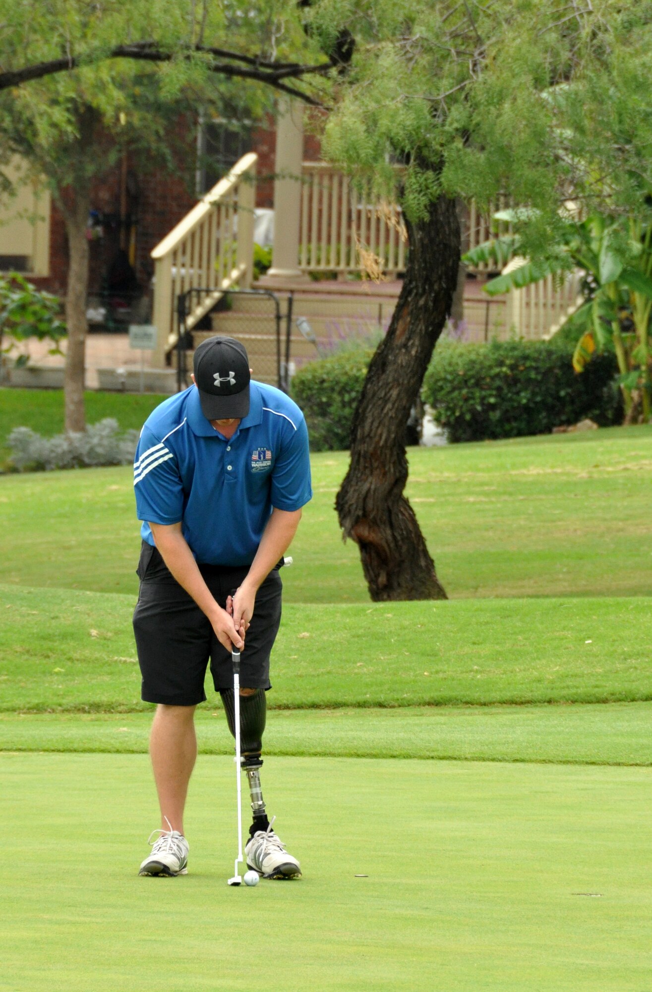One of the Bush Center Warrior Open participants sets his shot during the final day at the Las Colinas Country Club Golf course in Irving, Texas. Eighteen wounded warriors from the Air Force, Army and Marines joined in a competitive two-day, 36-hole golf tournament that kicked off Sept. 26, 2013, to honor post-9/11 U.S. service members wounded in the global war on terror. (U.S. Air Force photo/MSgt Julie Briden-Garcia)