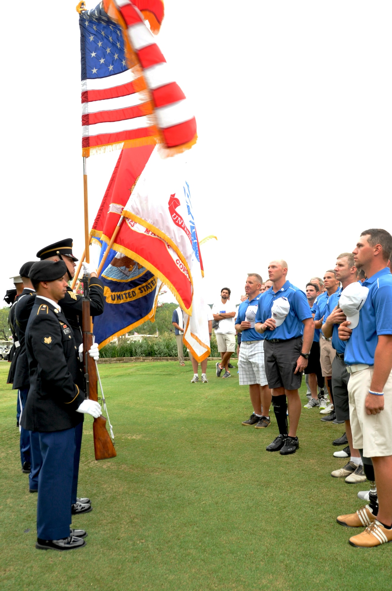 The 301st Fighter Wing Joint Color Guard presented the colors during the opening ceremony of the Bush Center Warrior Open Golf Tournament's final day held at Las Colinas Cournty Club in Irving, Texas. Eighteen wounded warriors from the Air Force, Army and Marines joined in a competitive two-day, 36-hole golf tournament that kicked off Sept. 26, 2013, to honor post-9/11 U.S. service members wounded in the global war on terror. (U.S. Air Force photo/MSgt Julie Briden-Garcia)