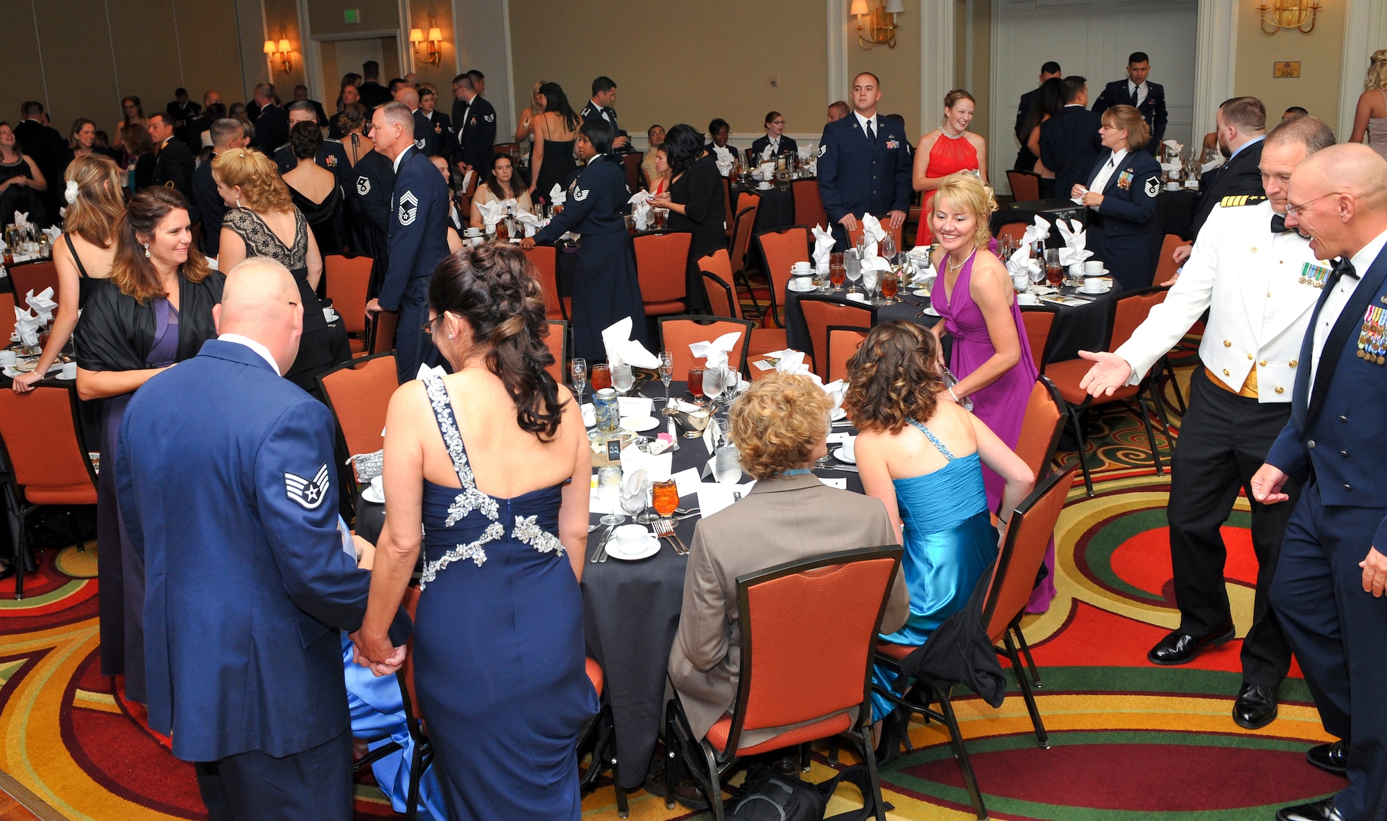 Attendees of the Air Force Ball take their seats Sept. 27, 2013, at the Renaissance Hotel in Denver. This year’s celebration marked the 66th Air Force birthday and paid respects to 1st Lt. John Harold "Buck" Buckley the base’s namesake, who was killed during World War I 95 years ago. (U.S. Air Force photo by Senior Airman Phillip Houk/Released)