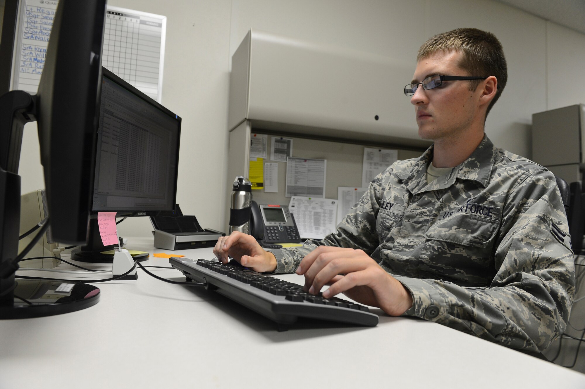 Airman 1st Class Jesse Manley, 2nd Comptroller Squadron accounting technician, works on a computer on Barksdale Air Force Base, La., Sept. 27, 2013. Airmen from the 2nd CPTS worked after normal duty hours for the end of fiscal year 2013 soft closeout. Any residual funding from purchases goes back into the allotted amount so it can be used toward other mission essential purchases. (U.S. Air Force photo/Senior Airman Micaiah Anthony) 

