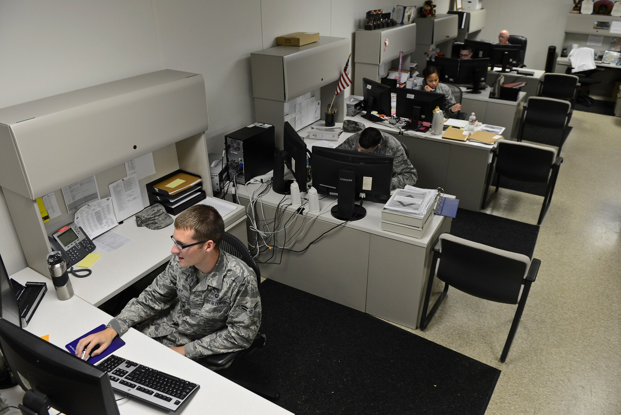 Airmen from the 2nd Comptroller Squadron work after normal duty hours for the end of fiscal year 2013 soft closeout on Barksdale Air Force Base, La., Sept. 27, 2013. Airmen from the 2nd CPTS communicate with Airmen from the 2nd Contracting Squadron during the closeout to ensure all funds are allocated. (U.S. Air Force photo/Senior Airman Micaiah Anthony)   
