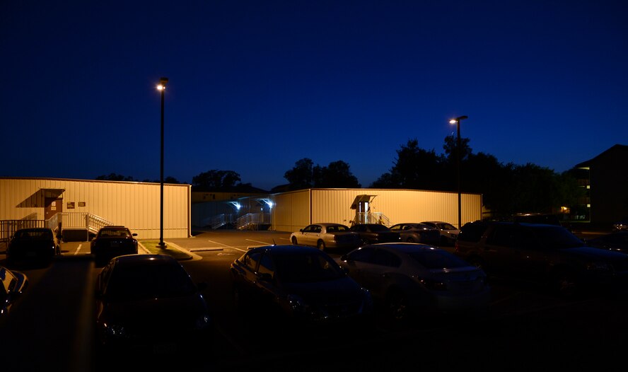 Airmen from the 2nd Comptroller Squadron walk to their cars after normal duty hours on Barksdale Air Force Base, La., Sept. 27, 2013. Each year the Air Force receives funding for defense related expenditures that must be allocated by Sept. 30. Airmen work longer hours during the end of Sept. to accomplish this task. (U.S. Air Force photo/Senior Airman Micaiah Anthony)   