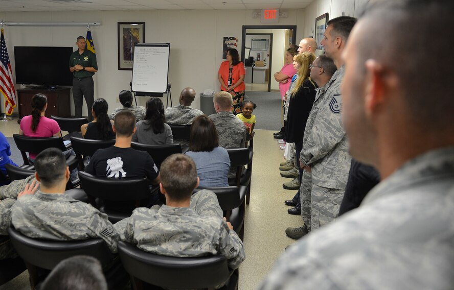 Lt. Col. Anthony Smith, 2nd Comptroller Squadron commander, briefs Airmen about the end of fiscal year 2013 soft closeout on Barksdale Air Force Base, La., Sept. 27, 2013. After the briefing, the Airmen partook in a potluck to boost morale.  (U.S. Air Force photo/Senior Airman Micaiah Anthony)