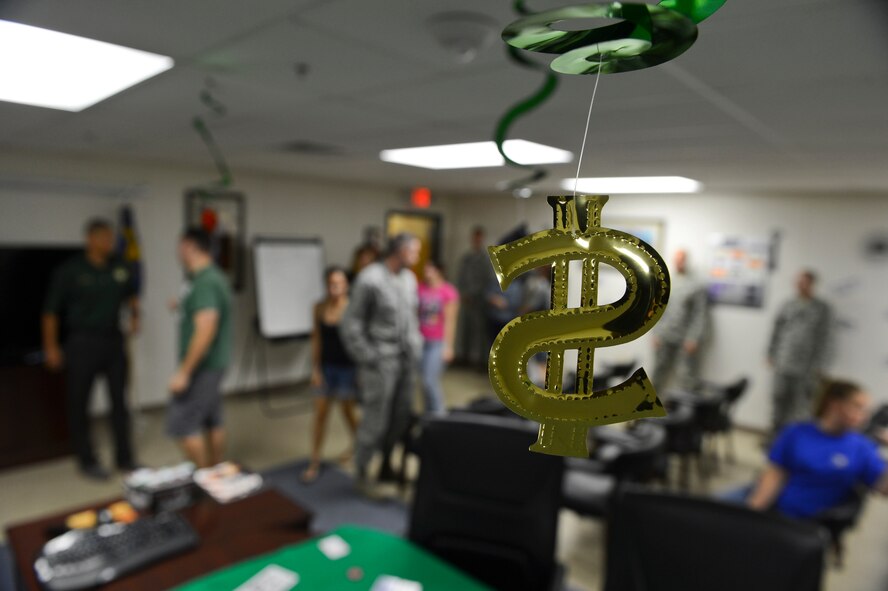Airmen from the 2nd Comptroller Squadron enter the main conference room of the 2nd CPTS building on Barksdale Air Force Base, La., Sept. 27, 2013. The Airmen gathered in the conference room for a briefing by Lt. Col. Anthony Smith, 2nd CPTS commander, about the end of fiscal year 2013 soft closeout. (U.S. Air Force photo/Senior Airman Micaiah Anthony)
