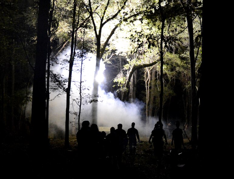 Zombies walk into the woods prior to the start of the Zombie Apocalypse paintball game on Barksdale Air Force Base, La., Sept. 28, 2013. As waves of zombies were released, the humans tried to shoot zombies in the head before they were infected by being shot with paintballs. (U.S. Air Force photo/Staff Sgt. Amber Corcoran)