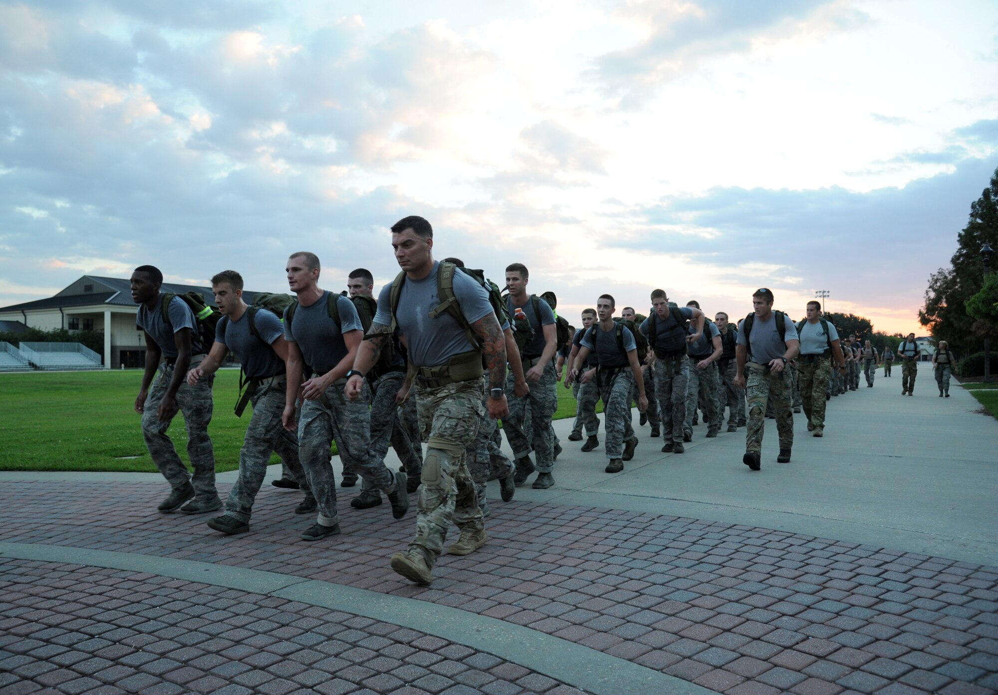Members of the 334th Training Squadron combat controllers and the 335th Training Squadron special operations weather team begin a memorial physical training session Sept. 27, 2013, at Keesler Air Force Base, Miss., with a ruck march around the base. The PT event was in memory of combat controller Senior Airman Mark Forester who was killed in action on Sept. 29, 2010. (U.S. Air Force photo by Kemberly Groue)