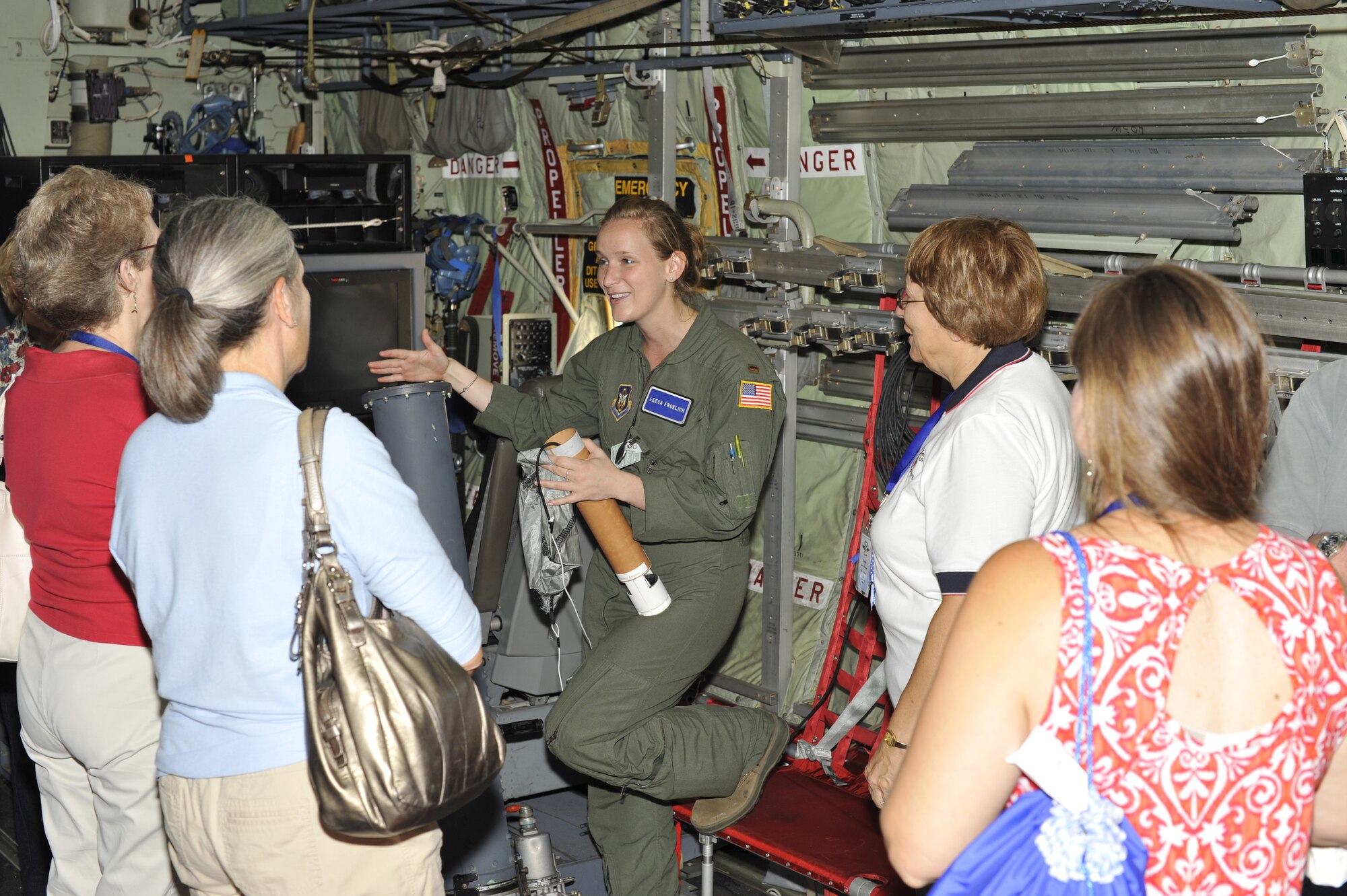 2nd Lt. Leesa Froelich, an aerial reconnaissance weather officer with the 53rd Weather Reconnaissance Squadron, briefs members of the Ninety Nines on how the dropsonde works after exiting the WC-130J into a hurricane, tropical storm or tropical depression during their visit to the 53rd WRS.  The Ninety Nines were given a tour to further educate the pilots on weather reconnaissance.  (U.S. Air Force Photo by Tech. Sgt. Jessica L. Kendziorek)