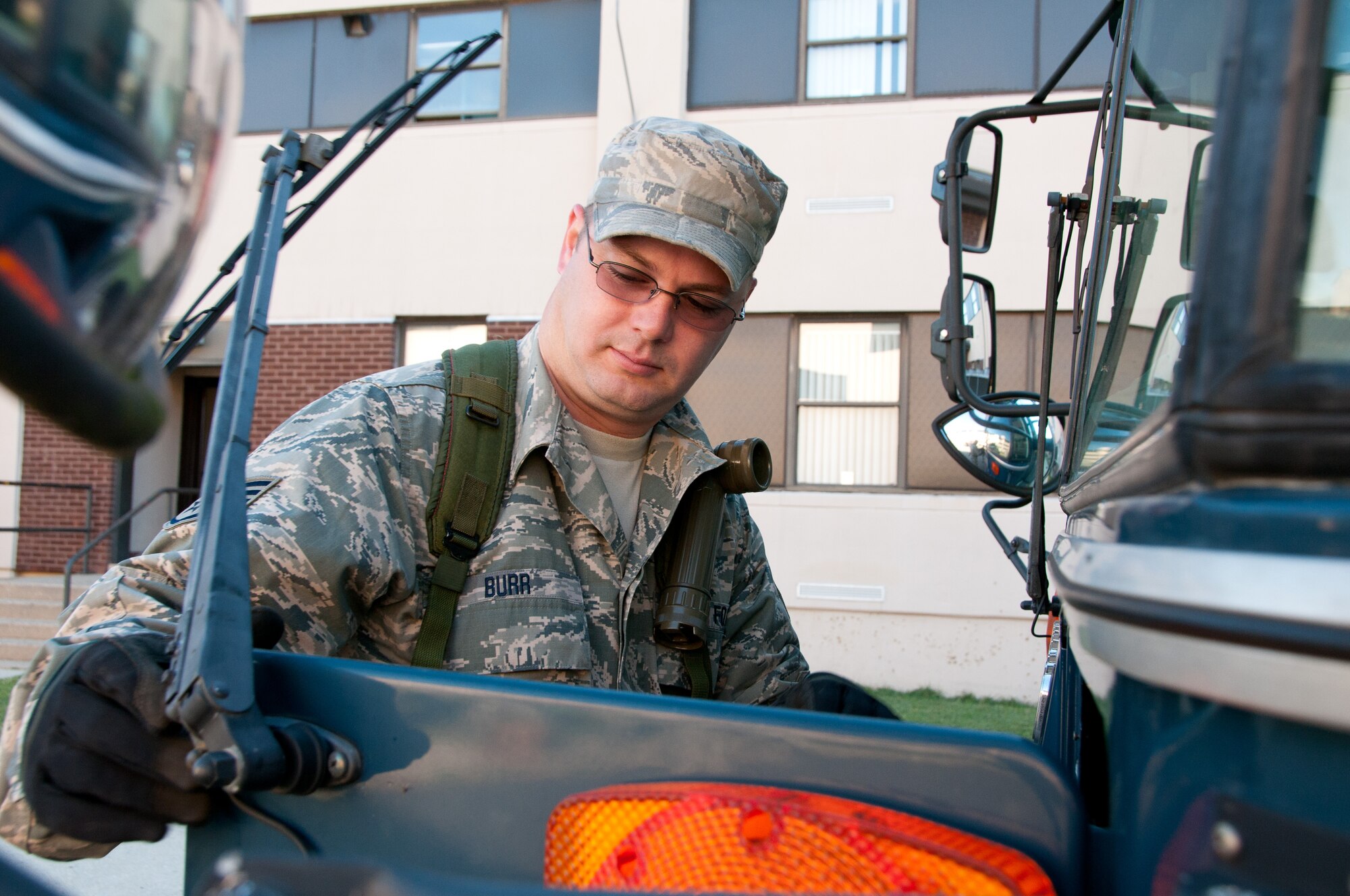 Staff Sgt. Stephen Burr, 108th Communications Flight,  inspects a vehicle  during the annual Quick Response Force (QRF) training September 29, 2013, at Joint Base McGuire-Dix-Lakehurst, N.J. QRF training teaches Guard members how to deal with disturbances when called to duty for civil support. (U.S. Air National Guard photo by Senior Airman Adrian R. Rowan)
