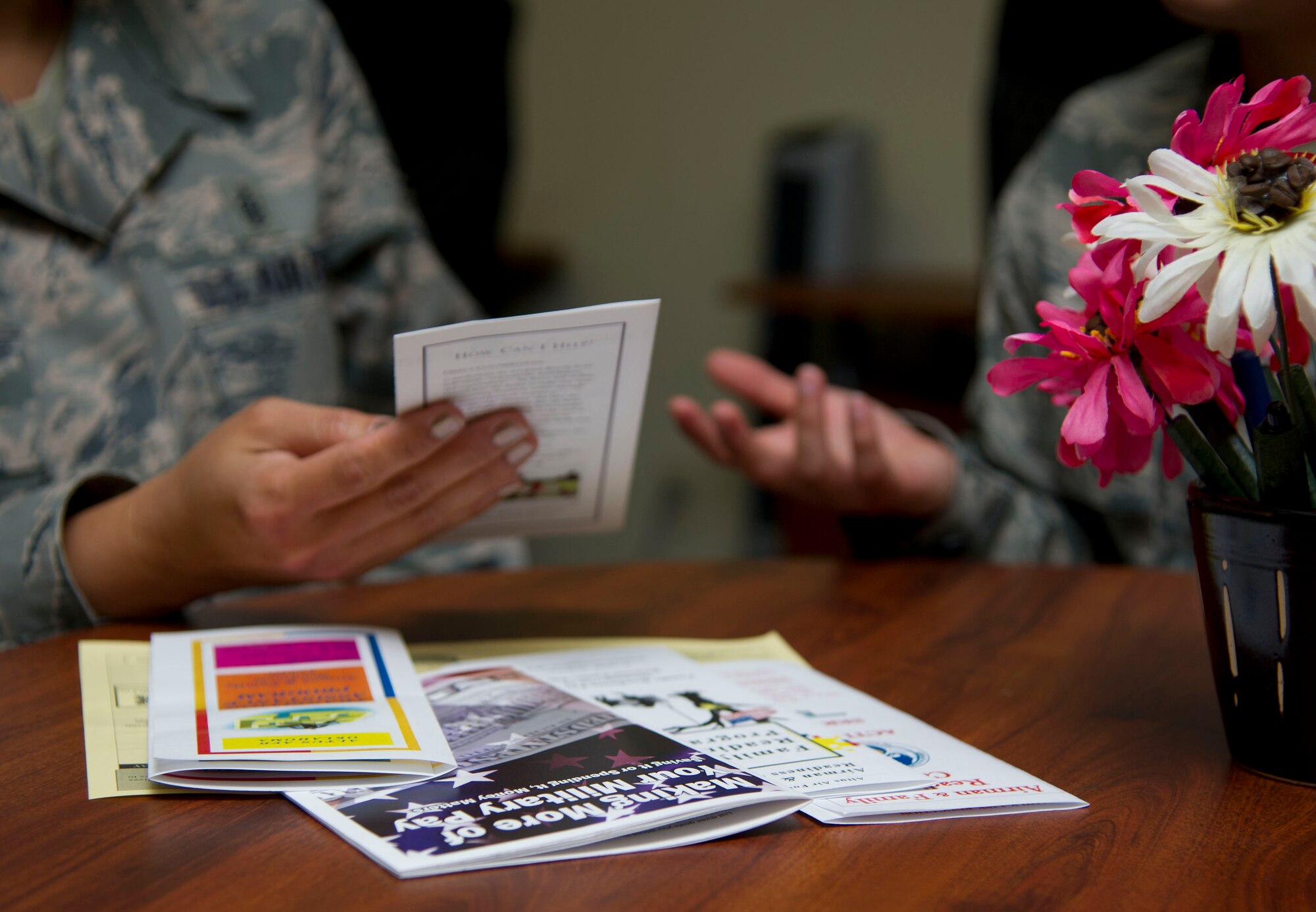 ALTUS AIR FORCE BASE, Okla. -- A member of the Airman and Family Readiness Center provides financial advice to an Airman Sept. 27, 2013. The A&FRC offers free services to Airmen and their families to include information and education to help enhance readiness and quality of life. (U.S. Air Force photo by Senior Airman Lausanne Genuino/Released)
