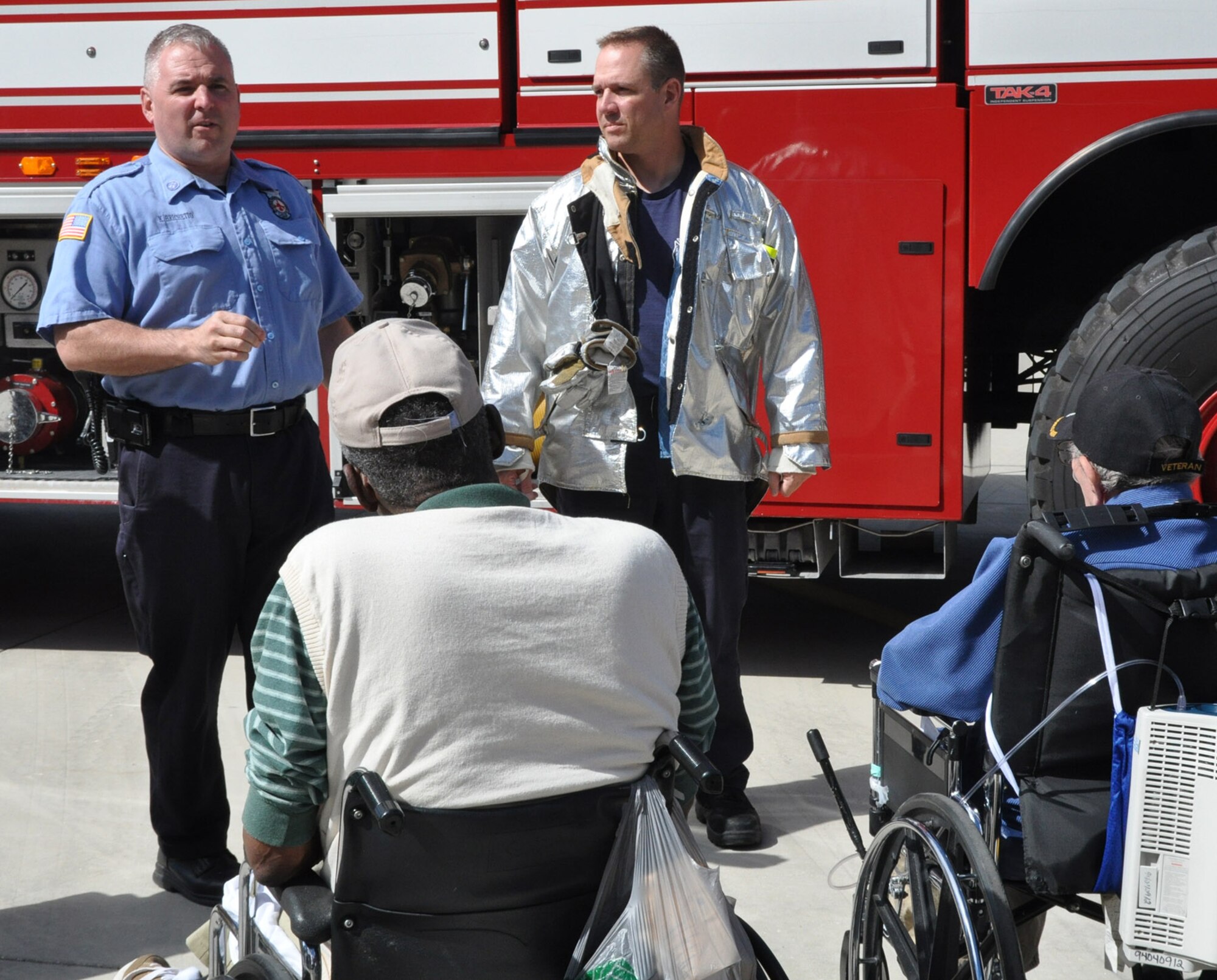 Air Force Reserve firefighters Kevin Brichetto and Dennis Kilker give a YARS fire department briefing and demonstrations to disabled veteran residents and staff here Sept. 27, 2013. About a dozen guests paid a visit here from Washington Square Healthcare Center in Warren.
Air Force Photo by Maj. Brent J. Davis
