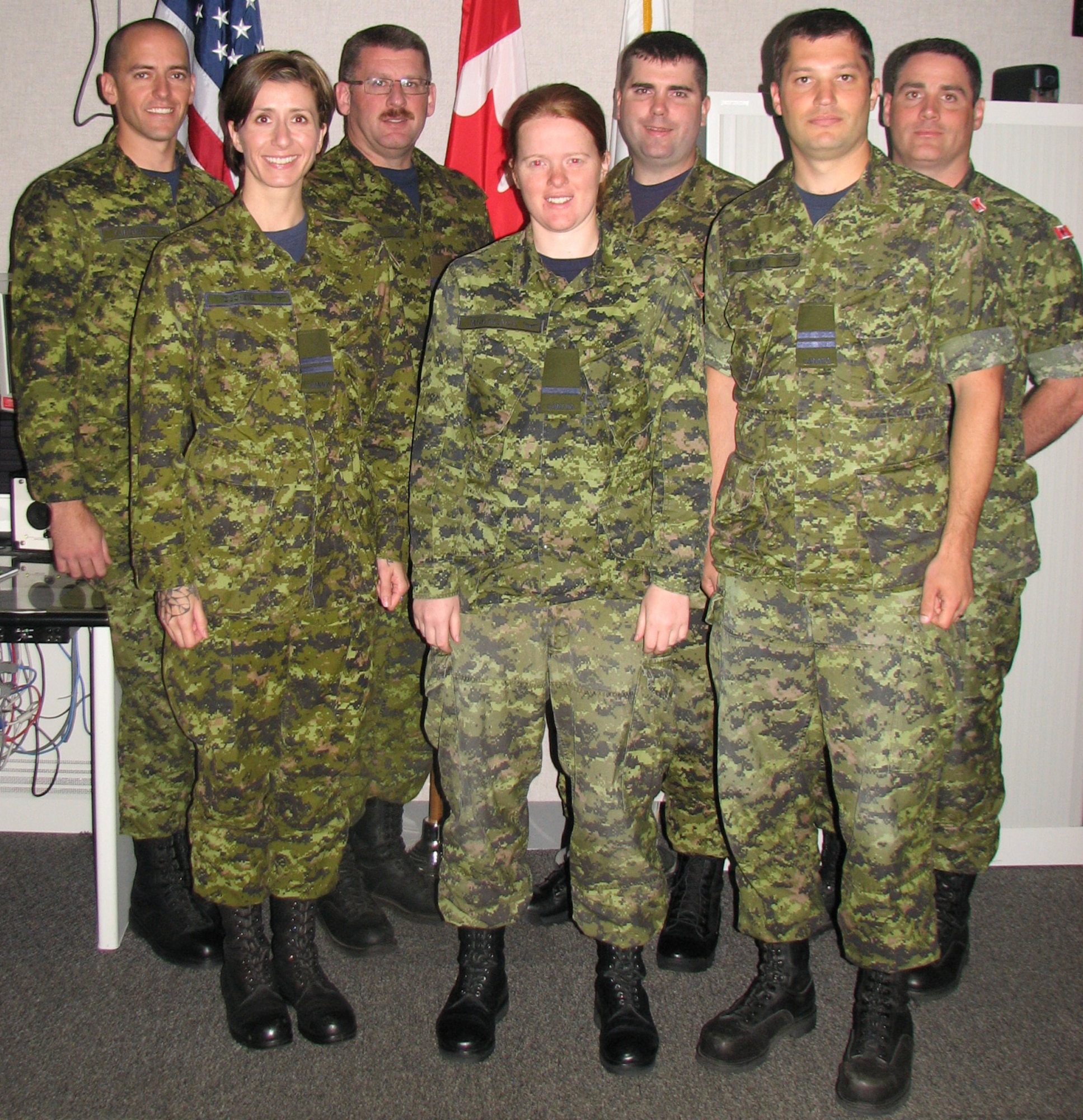 A group of Canadian student aerospace controllers and their instructors from the 51 Aerospace Control and Warning Operational Training Squadron in North Bay, Ont. just completed three weeks of training at the Eastern Air Defense Sector. Pictured in the front row are students:  Capt. Cynthia Duchene, 2nd Lt. Meghan McCready and. Capt. Michael Kallio. Back row, from left to right, are instructors Cpl. Terry Gibbins, Capt. Jim Mersereau, Capt. Michael Garrett and Capt. Joey Baker, the OIC for the training detachment.  