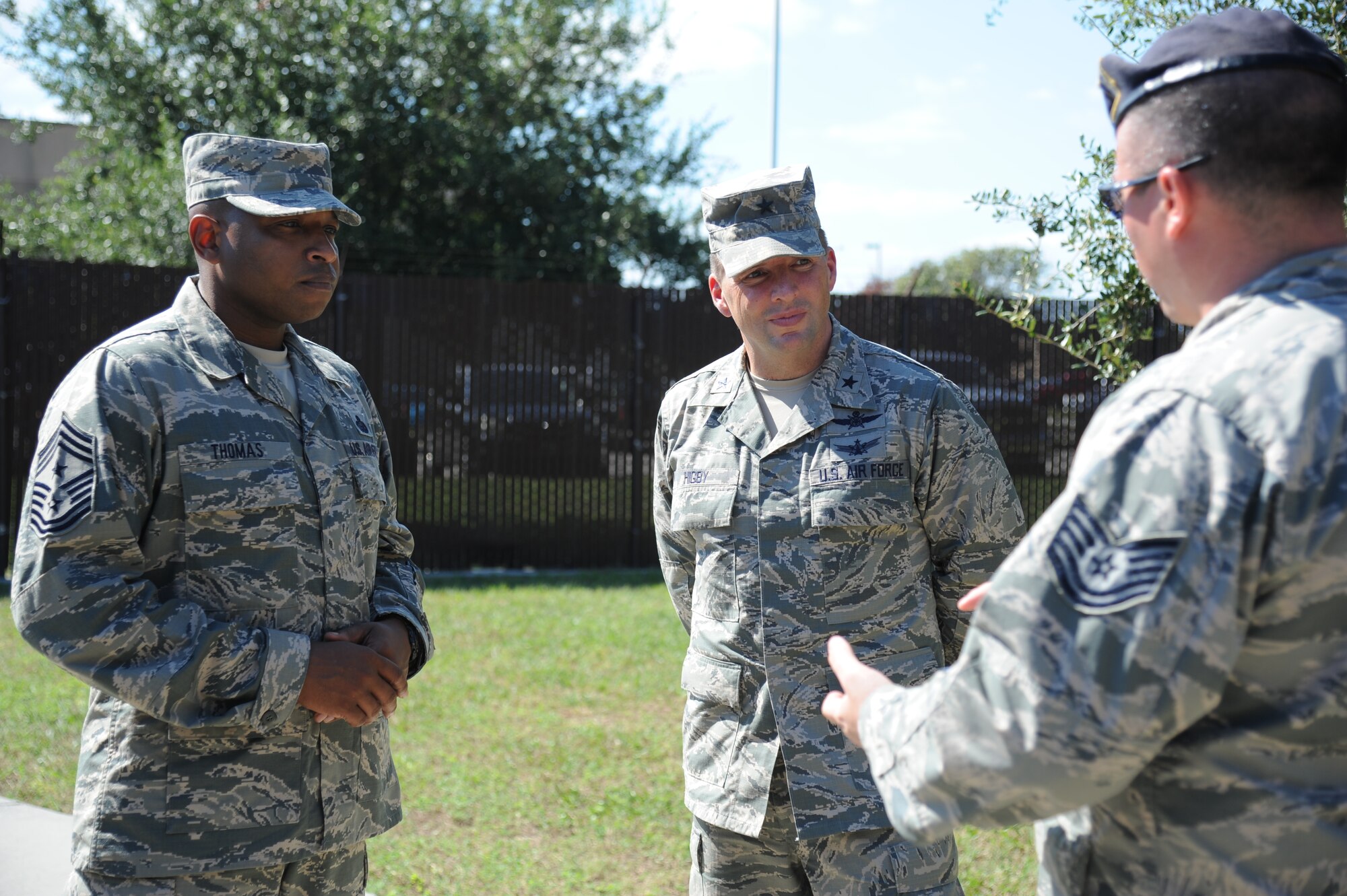 Chief Master Sgt. Farrell Thomas, 81st Training Wing command chief, and Brig. Gen. Patrick Higby, 81st TRW commander, are provided a tour of the 81st Security Forces military working dog kennels by Tech. Sgt. Christopher Perez, 81st SFS kennel master, Sept. 26, 2013, at Keesler Air Force Base, Miss.  The tour was a continuation of the 81st Mission Support Group immersion tour for Higby and Thomas.