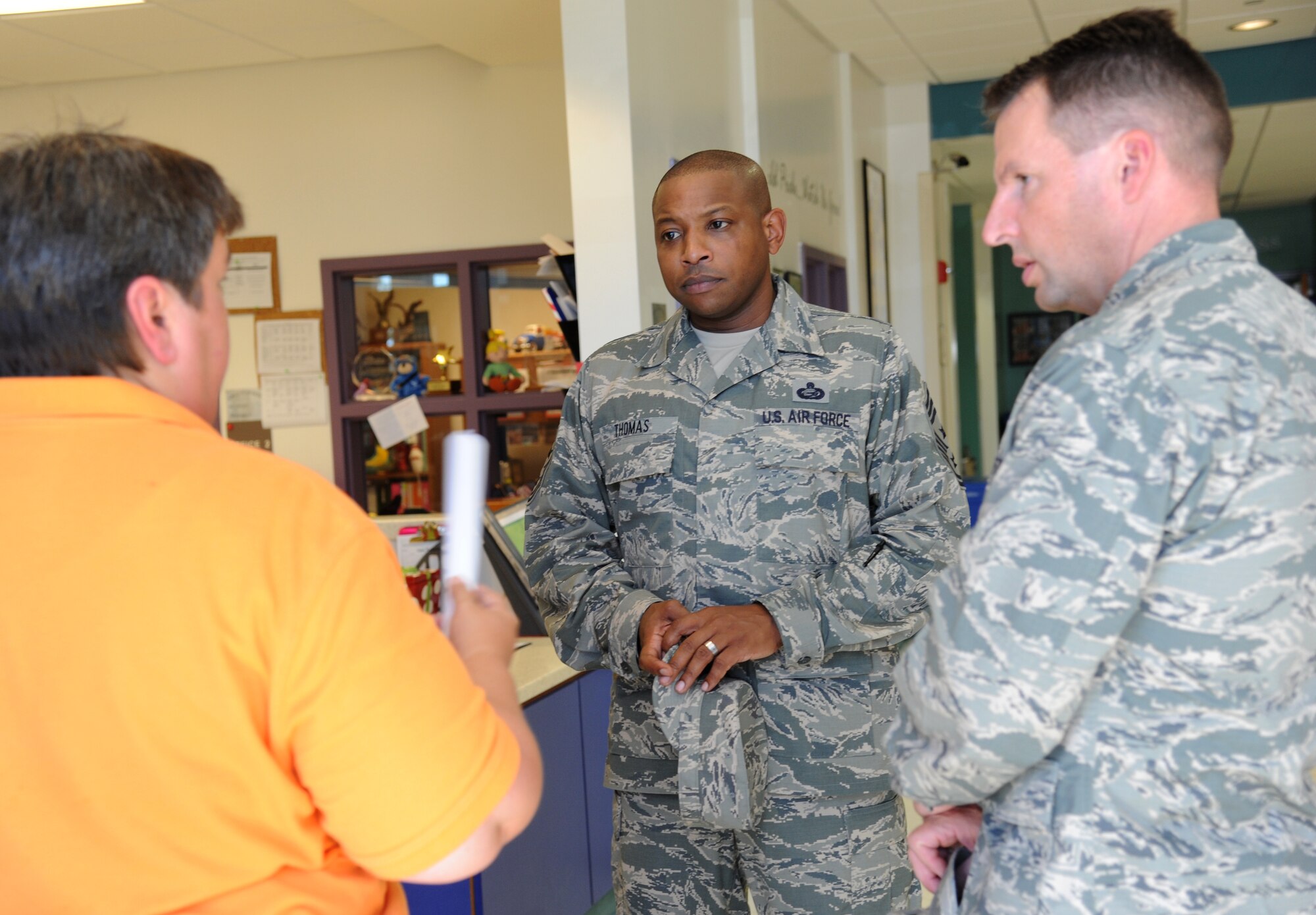 Jeryl Peterson, 81st Force Support Squadron, briefs Chief Master Sgt. Farrell Thomas, 81st Training Wing command chief, and Brig. Gen. Patrick Higby, 81st TRW commander, on the youth center’s programs and provides a tour of the facility Sept. 26, 2013, at Keesler Air Force Base, Miss.  The tour was a continuation of the 81st Mission Support Group immersion tour for Higby and Thomas.