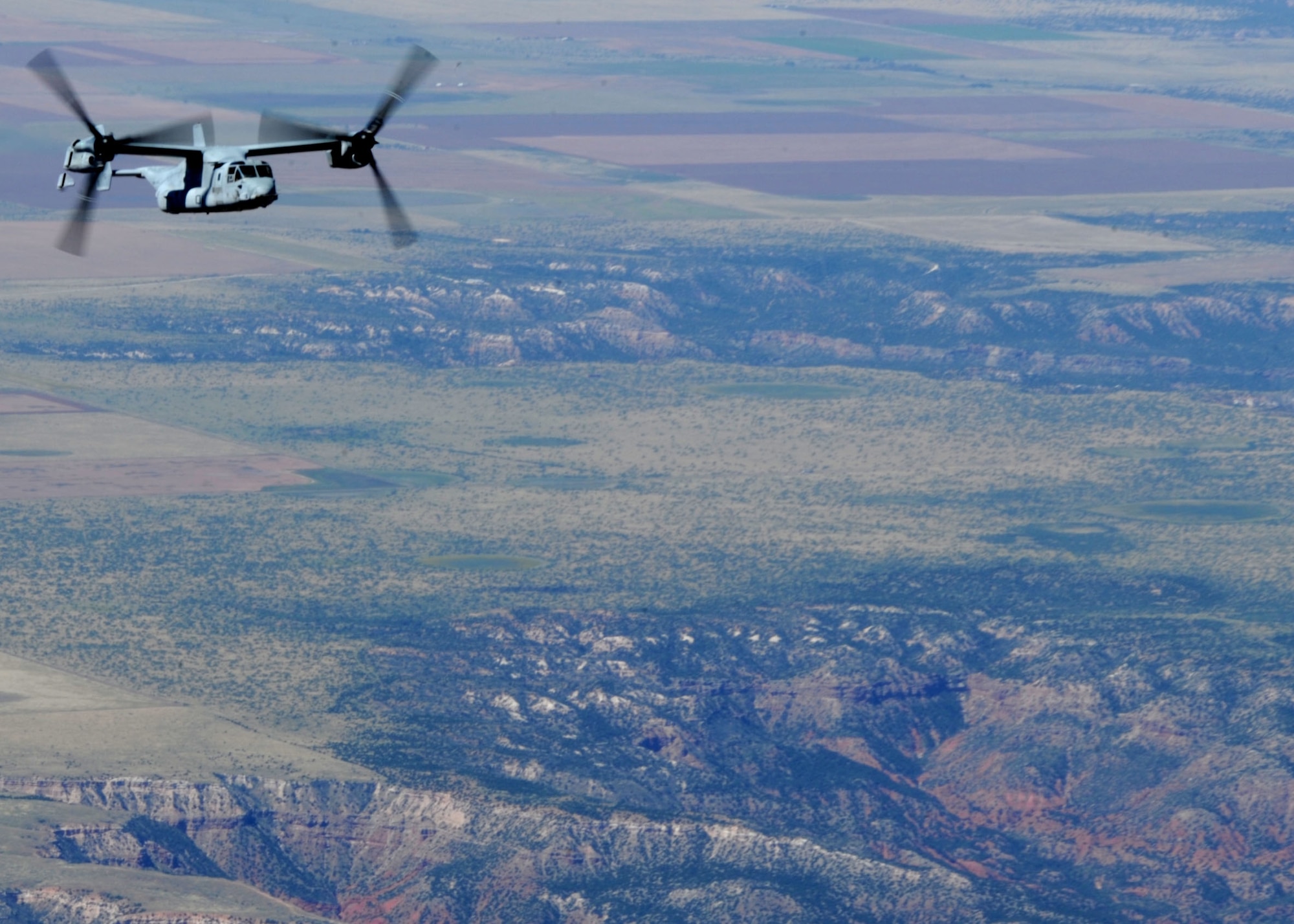 A CV-22 Osprey performs tactical maneuvers Sept. 26, 2013, over northern New Mexico. The Osprey flew as part of a joint training mission with the 522nd Special Operations Squadron and the 22nd Marine Expeditionary Unit. (U.S. Air Force photo/Senior Airman Ericka Engblom)
