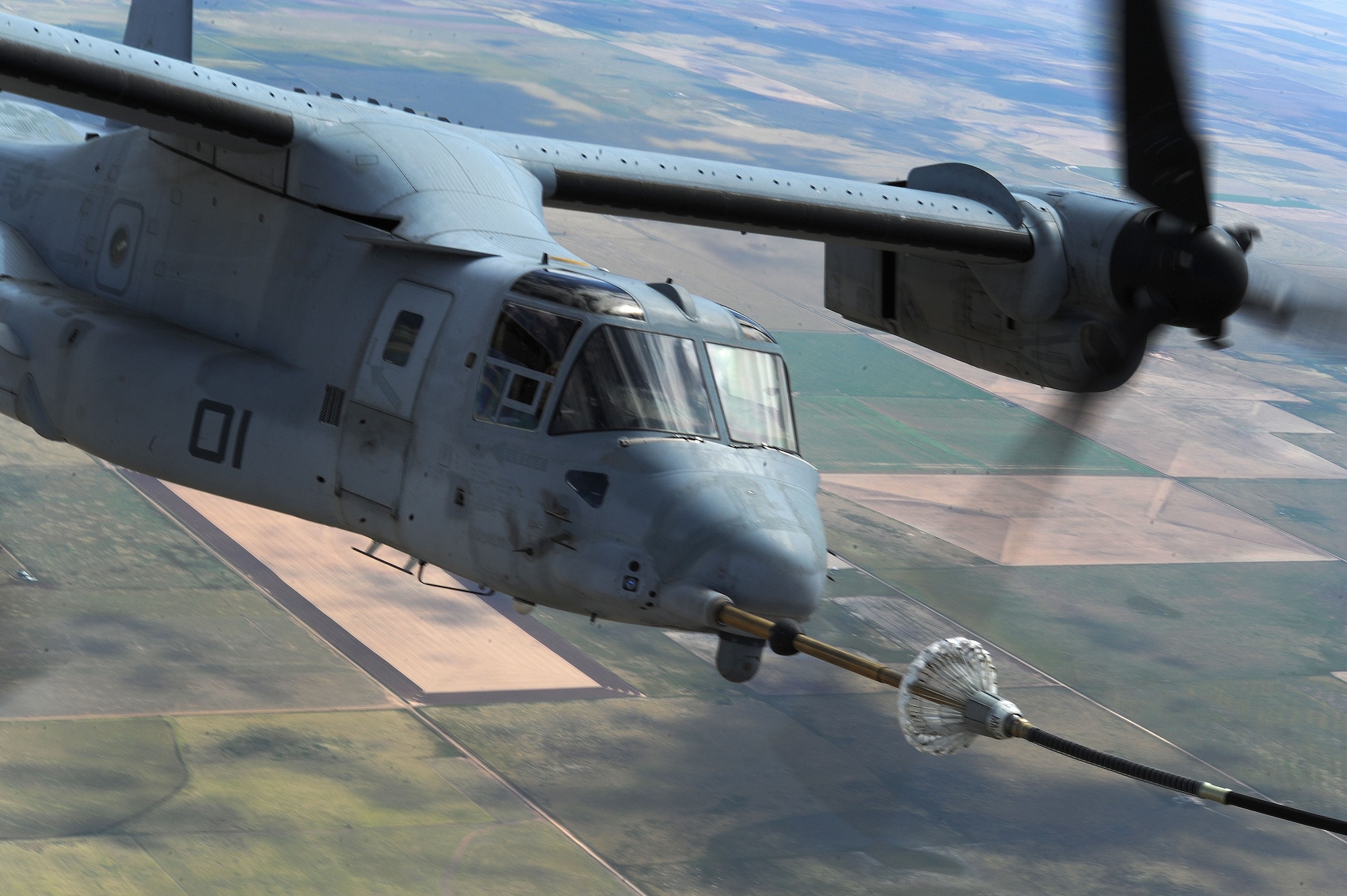 A CV-22 Osprey performs tactical maneuvers Sept. 26, 2013, over northern New Mexico The Osprey flew as part of a joint training mission with the 522nd Special Operations Squadron and the 22nd Marine Expeditionary Unit. (U.S. Air Force photo/Senior Airman Ericka Engblom)